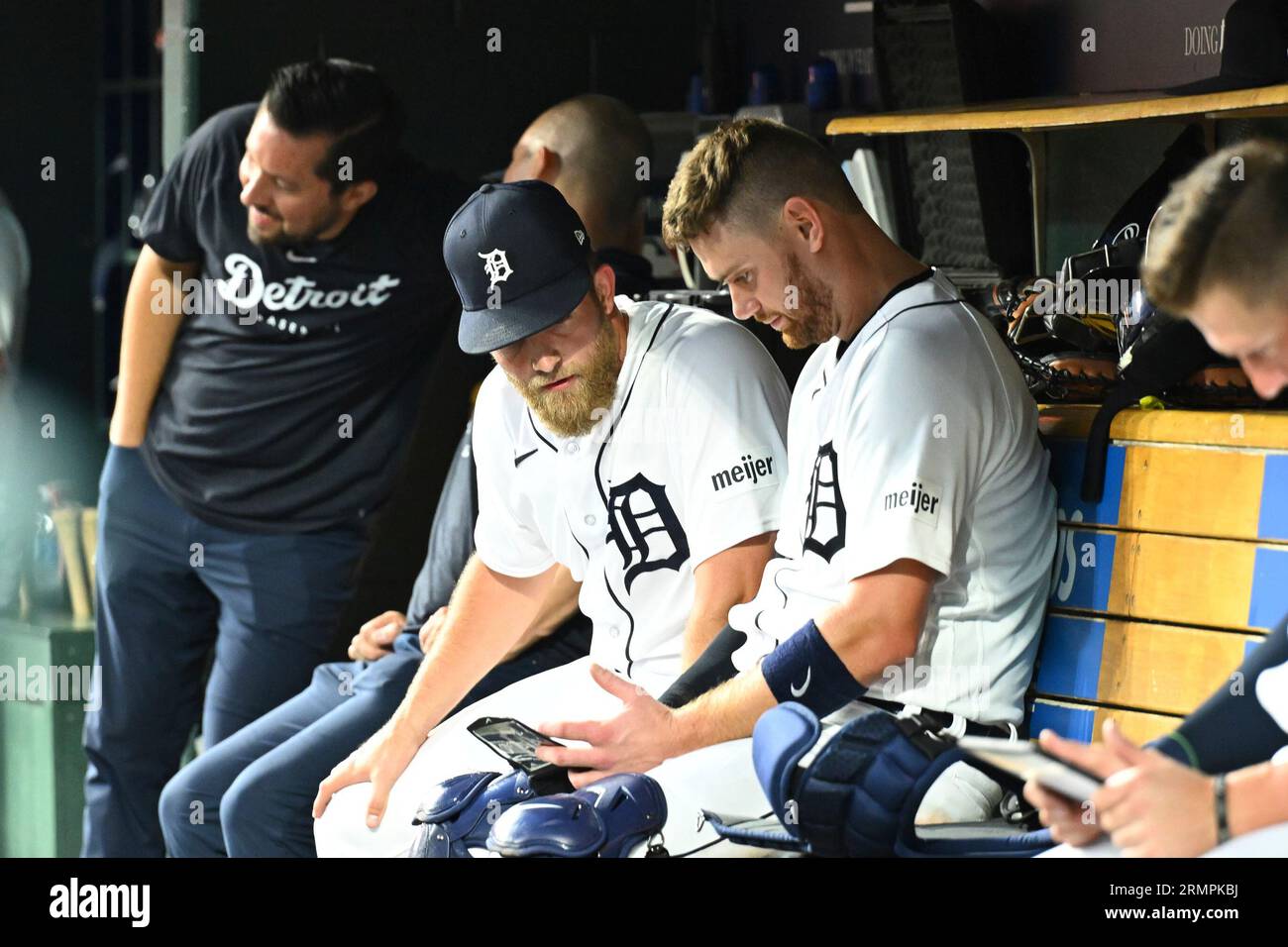 DETROIT, MI - AUGUST 29: Detroit Tigers first baseman Spencer Torkelson  (20) and Detroit Tigers relief pitcher Will Vest (19) look at their tablet  during the Detroit Tigers versus the New York