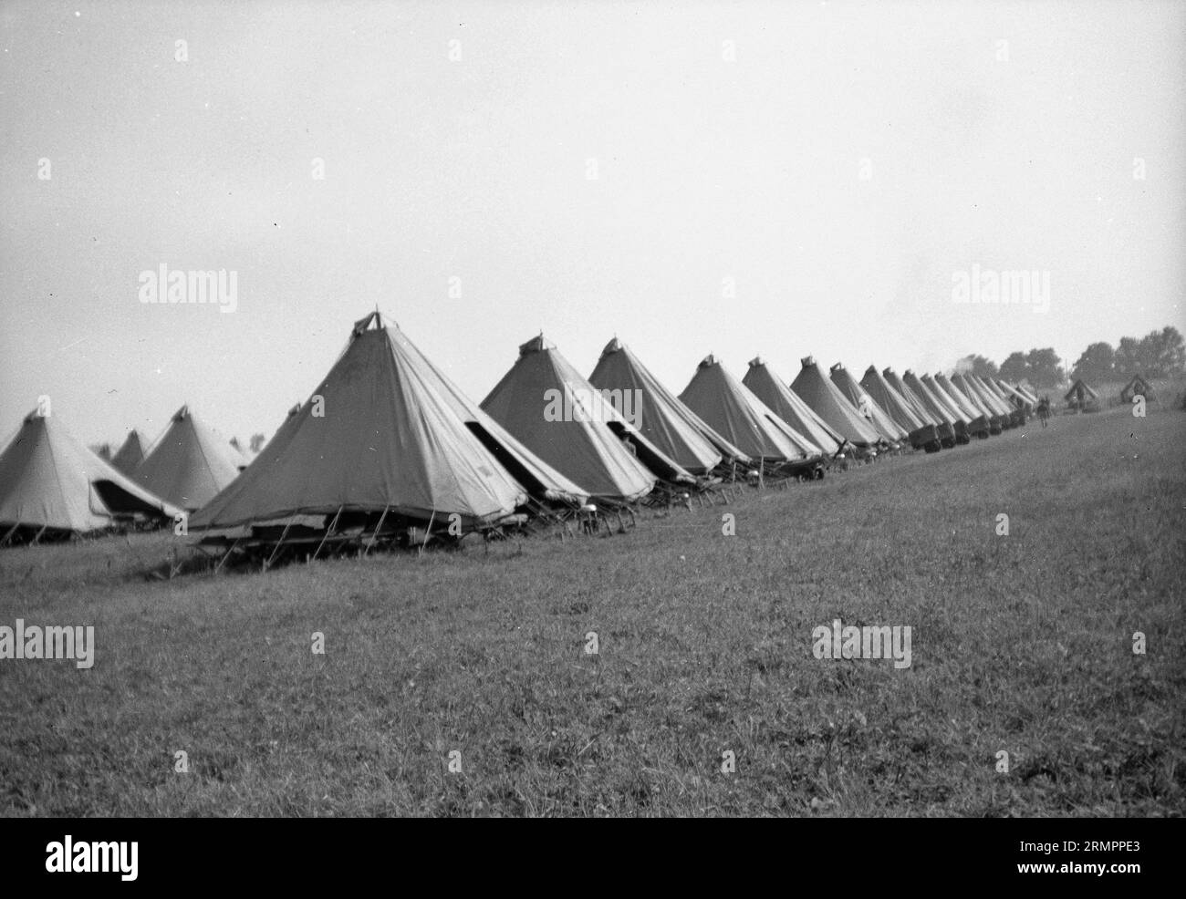 Line of tents at a camp. Members of the United States Army’s 114th infantry division train to fight against Germany in Europe during WWII. Stock Photo