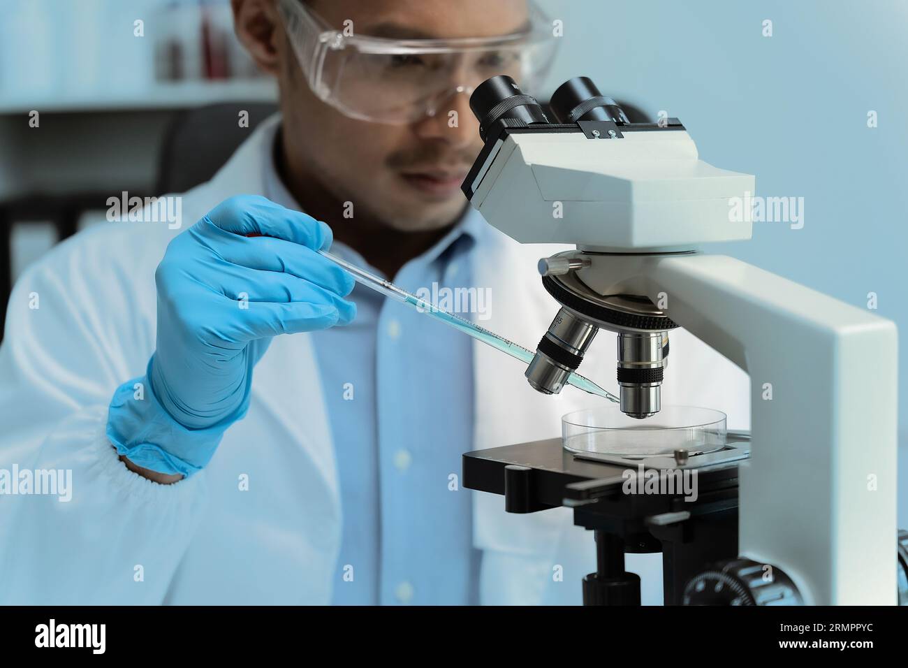 science testing substances biochemical research scientist working in a science lab Analyzing