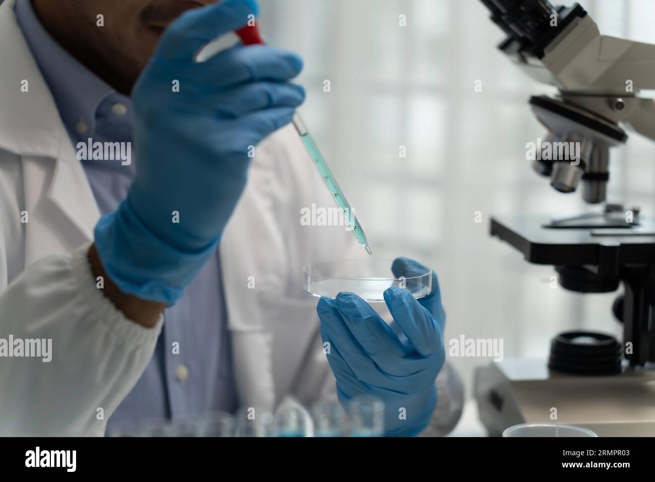 science testing substances biochemical research scientist working in a science lab Analyzing