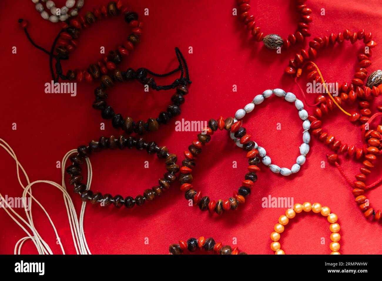 Handmade bracelets made of huayruro seeds, Seychelles souvenirs Stock Photo