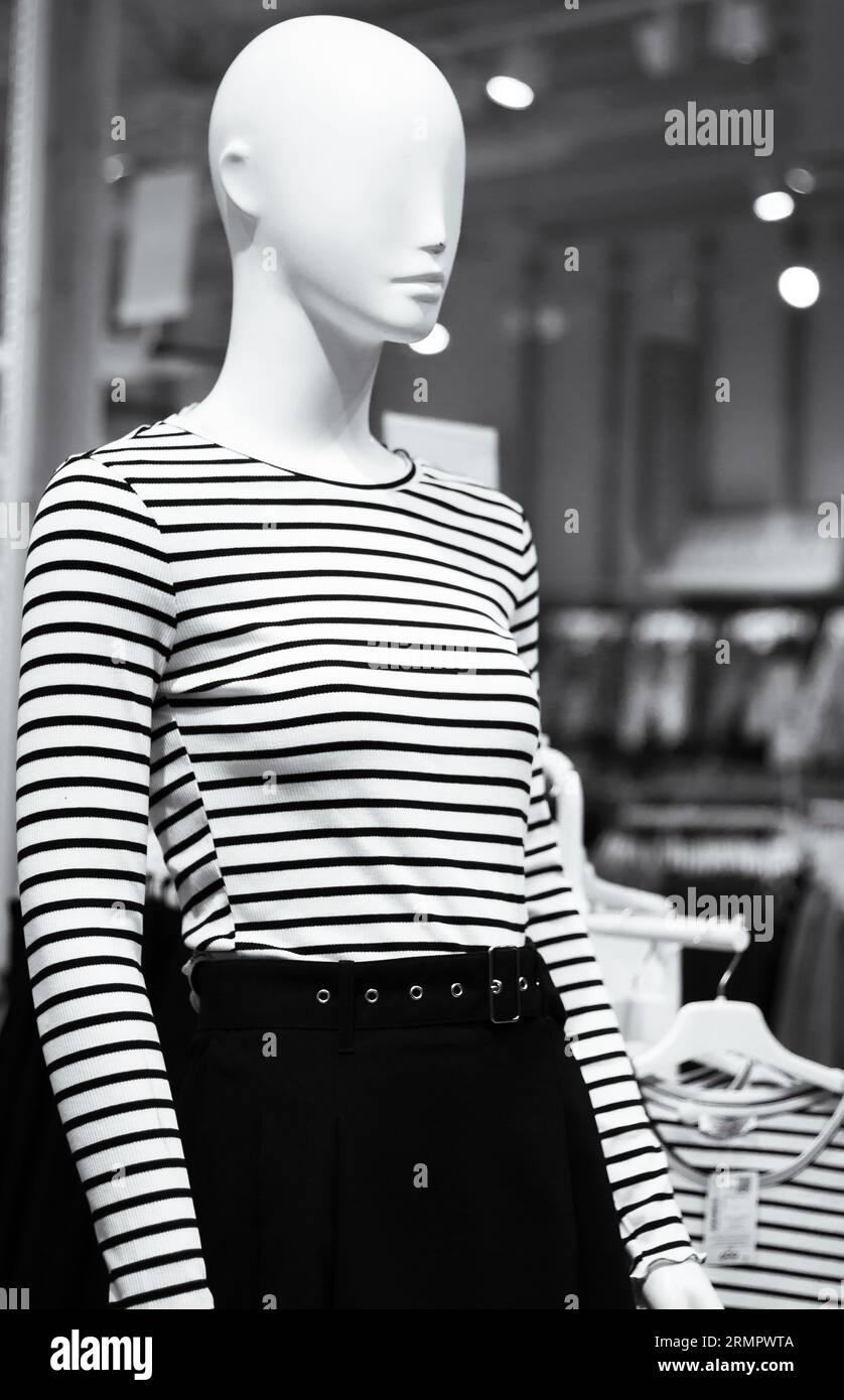 Mannequin in shop, black and white. New fashion collection, monochrome. Mannequin in shopping mall. Woman clothing on the dolls. Outfit concept. Stock Photo