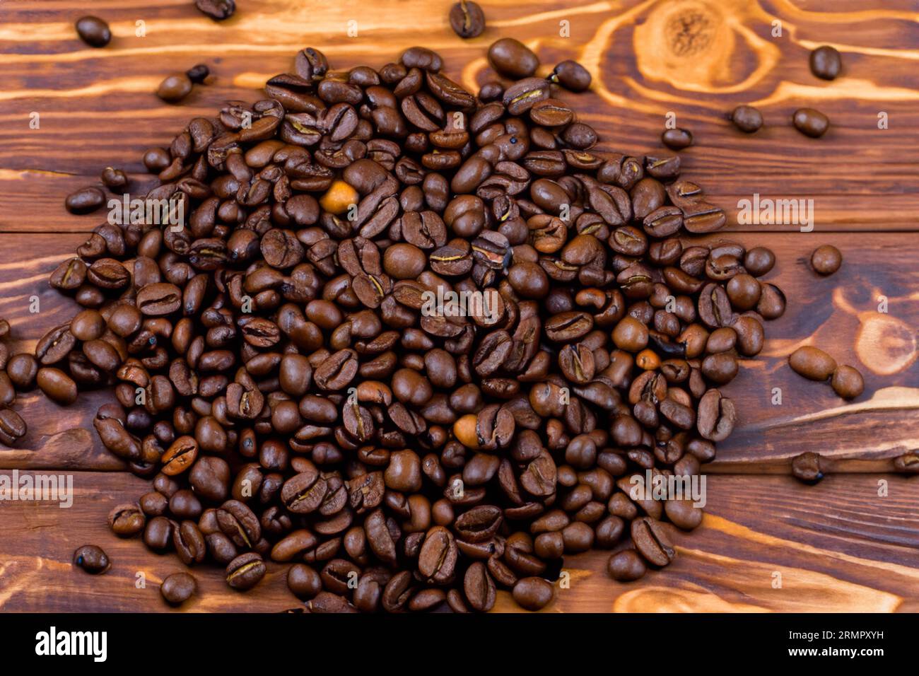 ground coffee powder with organic coffee beans on the old wooden table Stock Photo