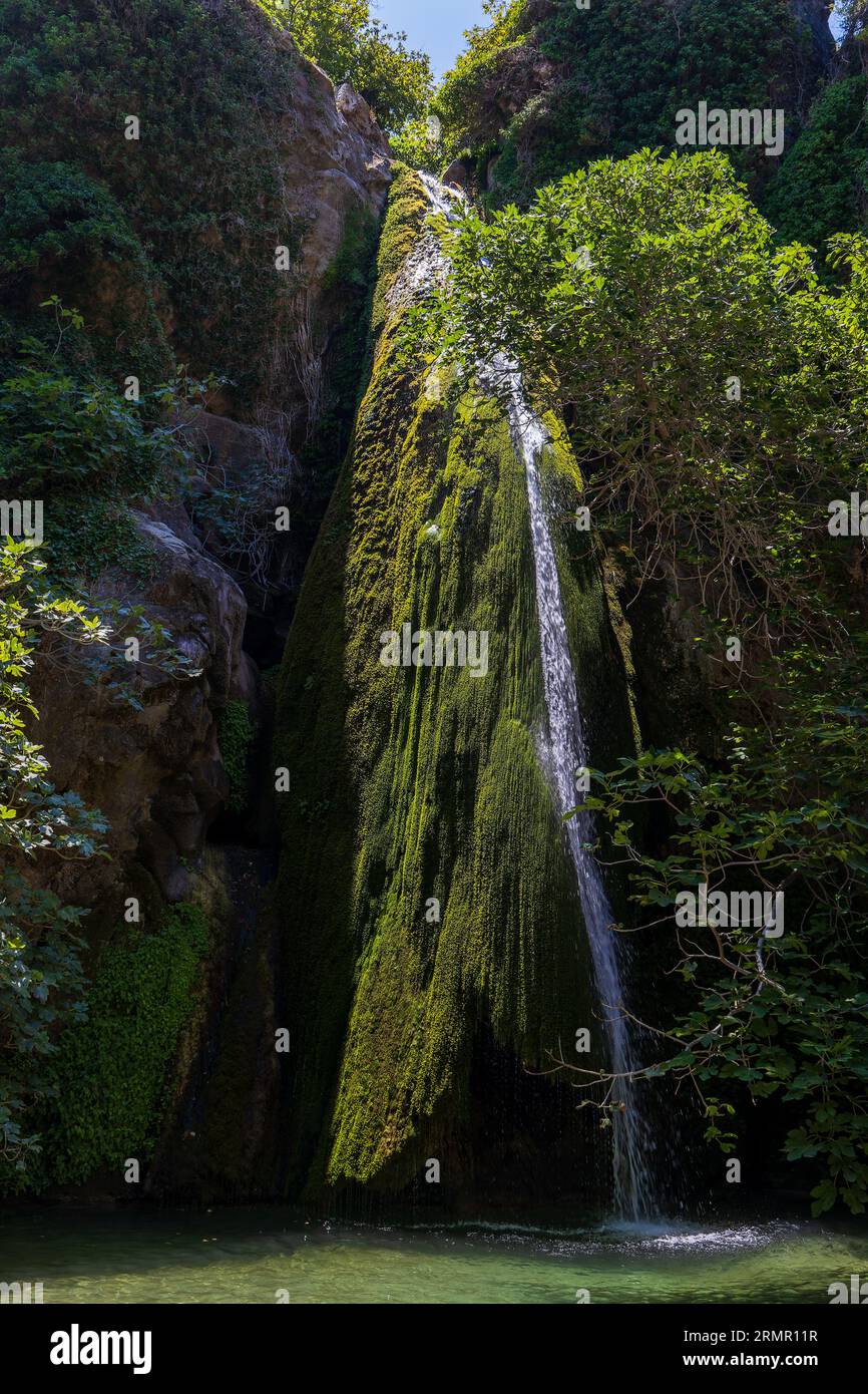 A small waterfall and pool at the bottom of a large (Richtis