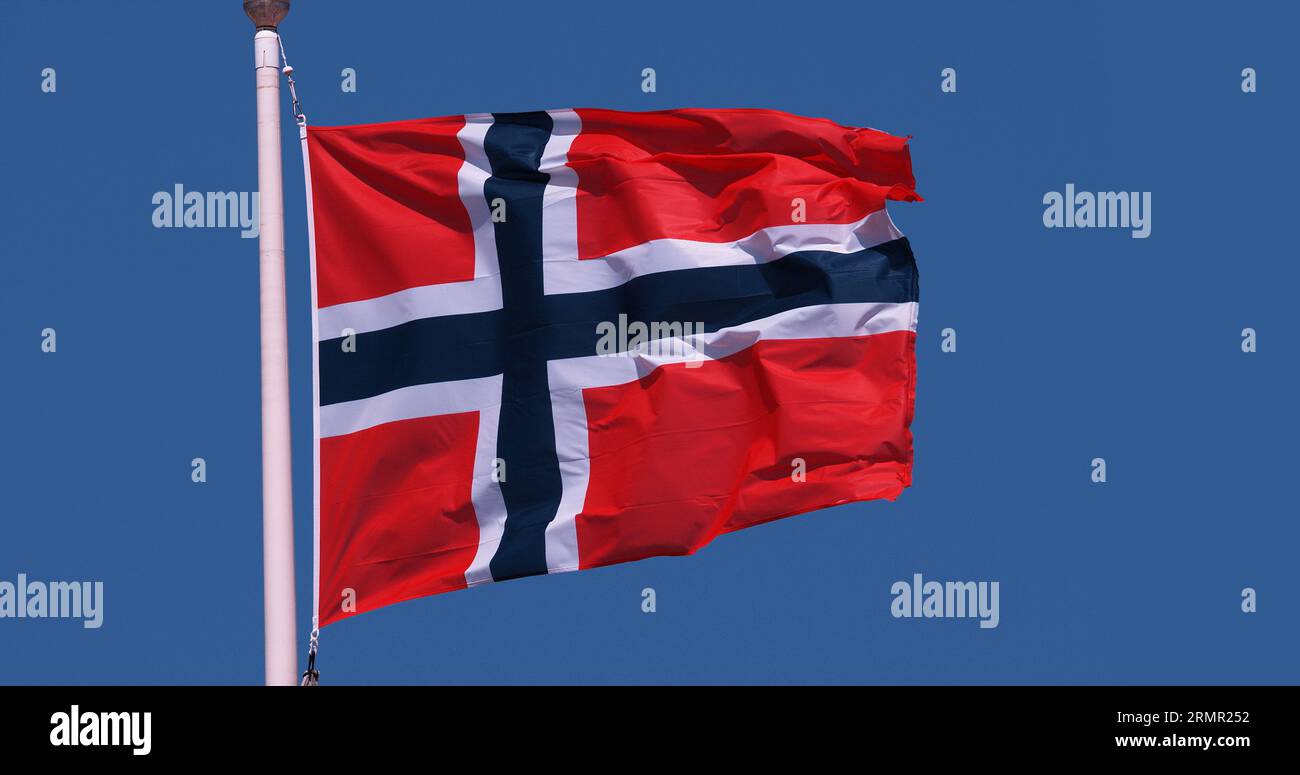 Norwegian Flag Waving in the Wind against blue sky Stock Photo - Alamy