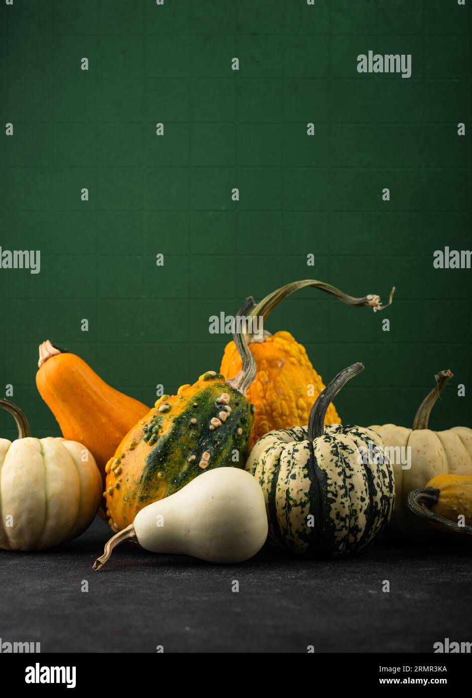 Decorative pumpkin on green background Stock Photo - Alamy