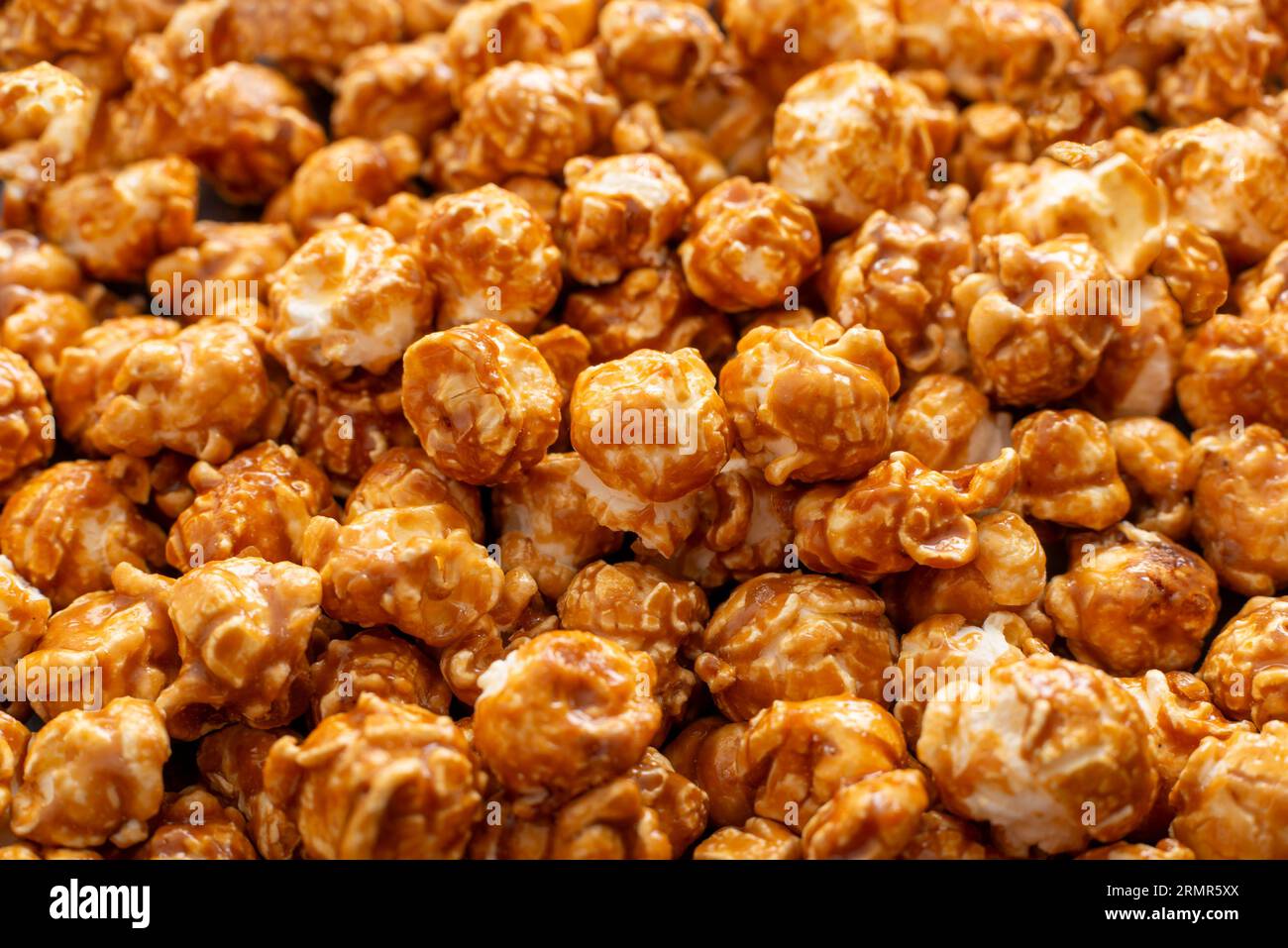 Caramelized sweet popcorn flakes gluten free food background Stock