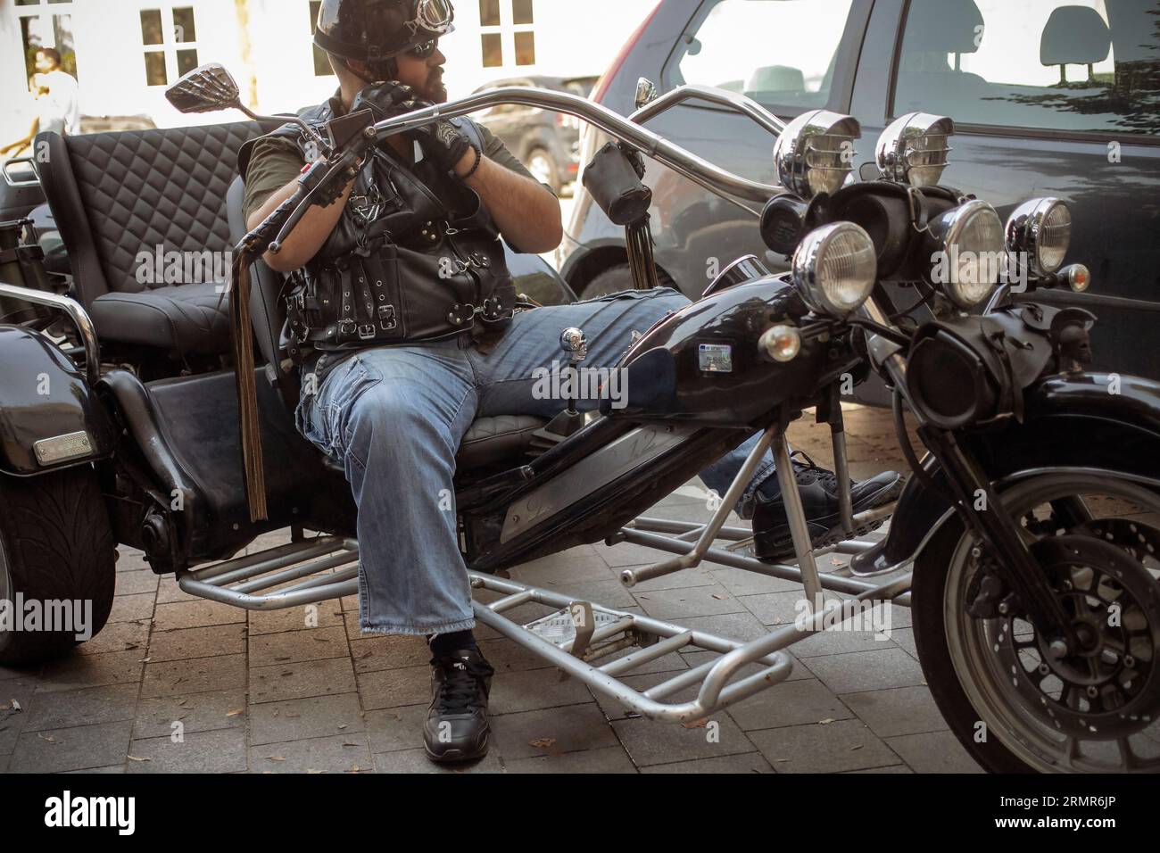 Belgrade, Serbia, Aug 19, 2023: Biker seated on a three-wheeled motorcycle Stock Photo