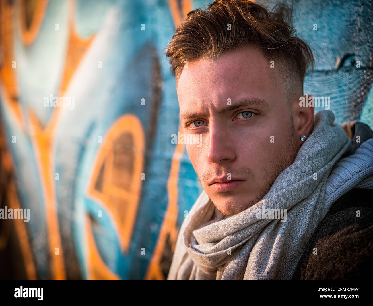A man with a scarf around his neck Stock Photo