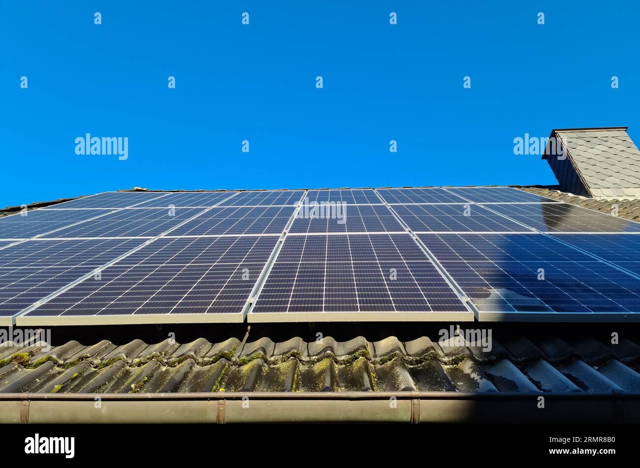 Solar Panels Producing Clean Energy On A Roof Of A Residential House ...