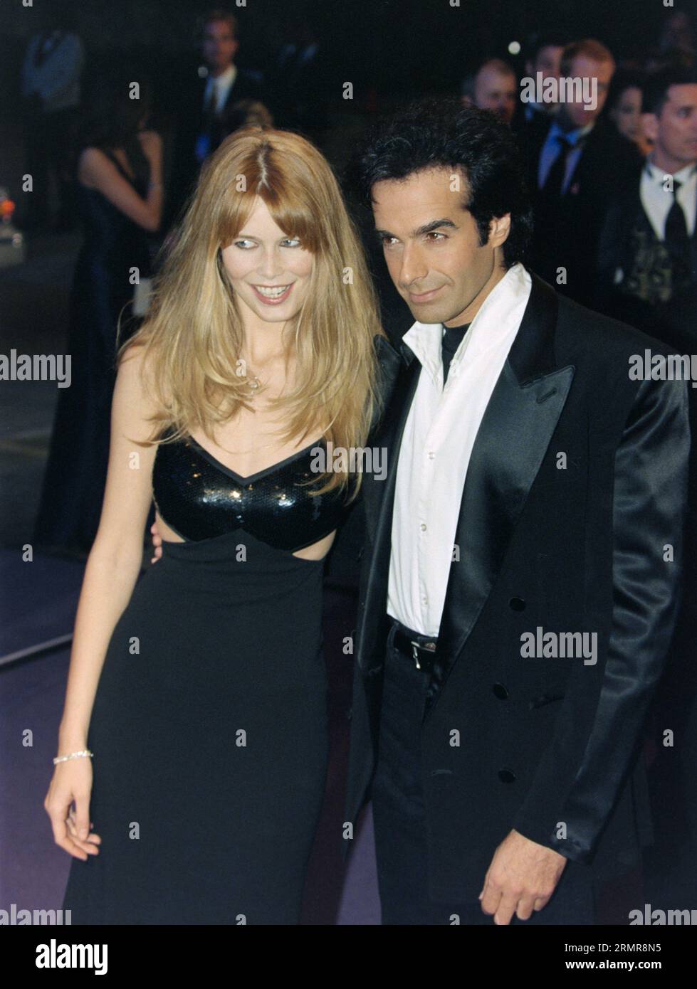 LOS ANGELES, CA. 16th February 1997:  Claudia Schiffer & David Copperfield at Elizabeth Taylor’s 65th birthday party in Los Angeles. Picture: Paul Smith / Featureflash Stock Photo
