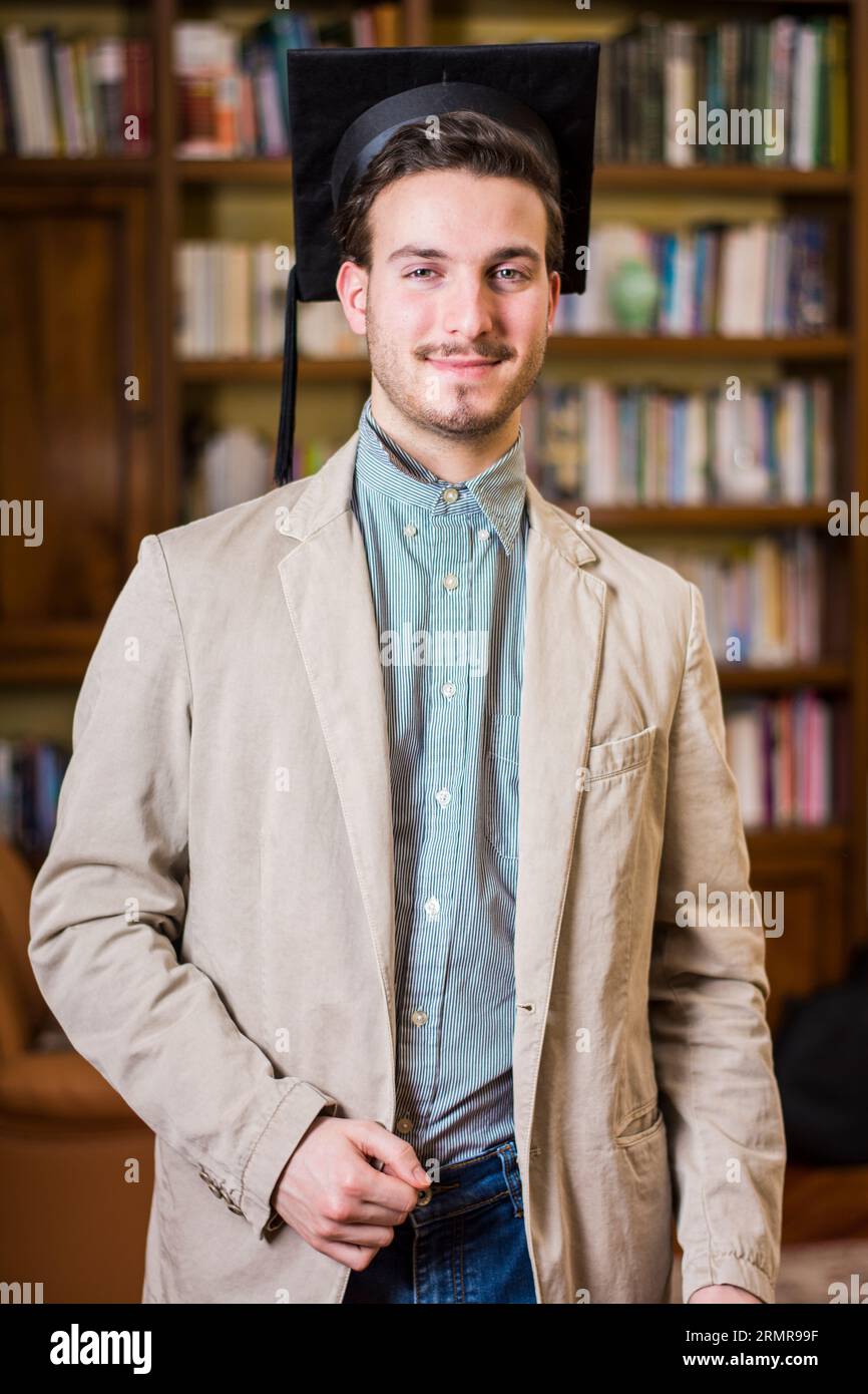 A man in a graduation cap and gown Stock Photo Alamy