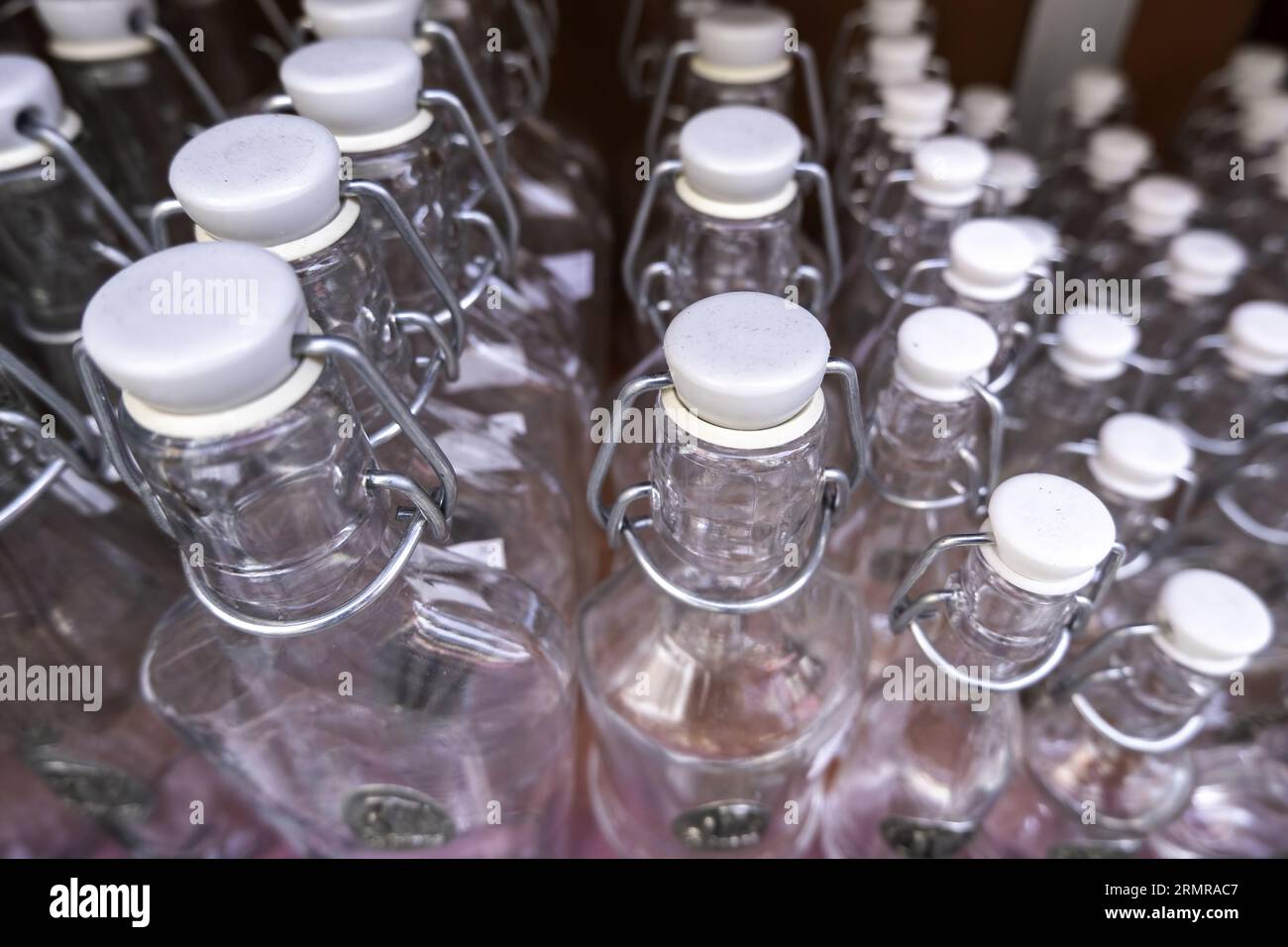 Detail of bottles to fill with blessed water, religious pilgrimage, belief and faith Stock Photo