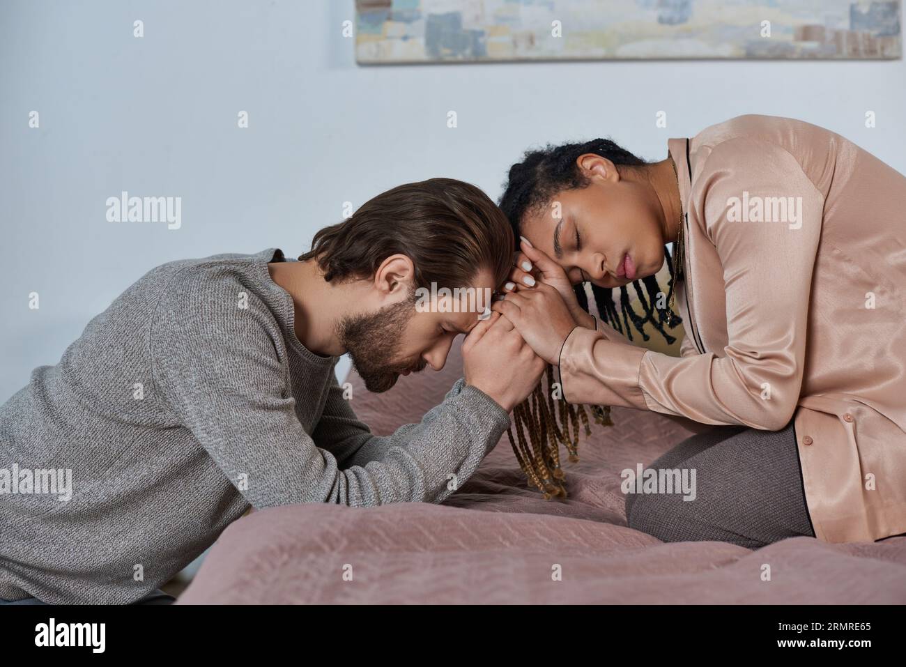 sad african american woman holding hands with man, worried multicultural couple bonding, empathy Stock Photo