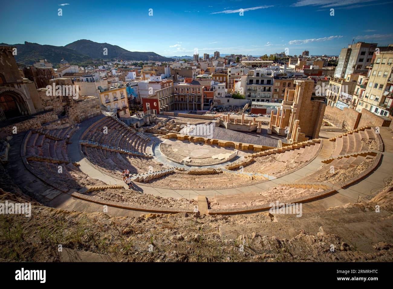 General view of the Roman theater in Cartagena, Region of Murcia, Spain, with the city in the background Stock Photo