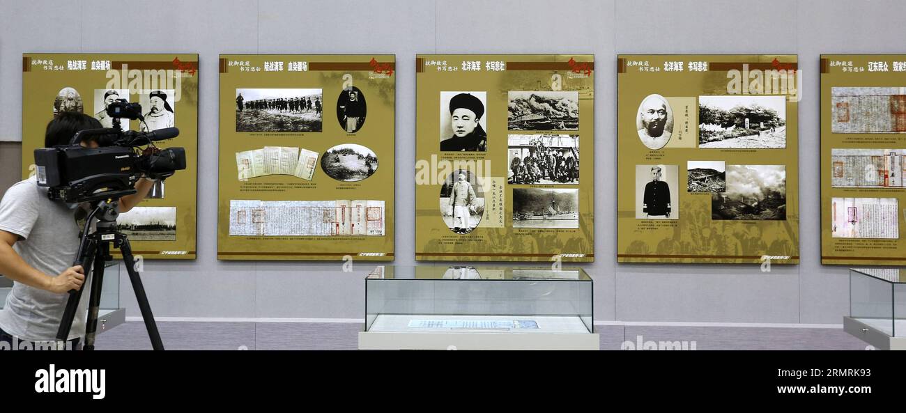 (140724) -- SHENYANG, July 24, 2014 (Xinhua) -- A journalist shoots the file and photo exhibition marking the 120th anniversary of the First Sino-Japanese War, in Shengyang, capital of northeast China s Liaoning Province, July 24, 2014. The exhibition displayed more than 200 files and photos about the war in 1894. (Xinhua/Yao Jianfeng) (hpj) CHINA-SHENYANG-FIRST SINO-JAPANESE WAR-FILE, PHOTO EXHIBITION (CN) PUBLICATIONxNOTxINxCHN   Shenyang July 24 2014 XINHUA a Journalist Shoots The File and Photo Exhibition marking The  Anniversary of The First SINO Japanese was in Sheng Yang Capital of Nort Stock Photo