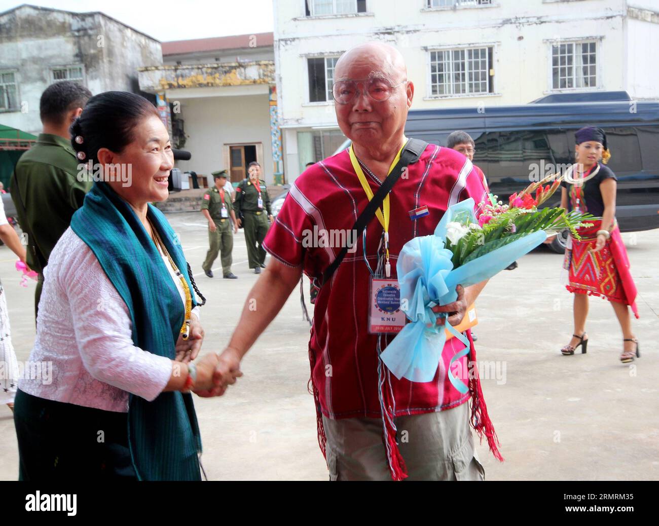 (140725) -- LAIZA, July 25, 2014 (Xinhua) -- Chairman of Kayin National Union (KNU) Gen. Saw Mutu Say Poe (R), leader of the 16-member Leading Committee for the third ethnic summit, arrives to attend the third Myanmar ethnic summit in Laiza, northernmost Kachin state, Myanmar, July 25, 2014. The third Myanmar ethnic summit kicked off in Laiza, northernmost Kachin state, Friday to finalize their second draft of nationwide ceasefire agreement, local reports reaching here said. (Xinhua/Manaw Htun) MYANMAR-KACHIN STATE-LAIZA-ETHNIC SUMMIT PUBLICATIONxNOTxINxCHN   July 25 2014 XINHUA Chairman of  N Stock Photo