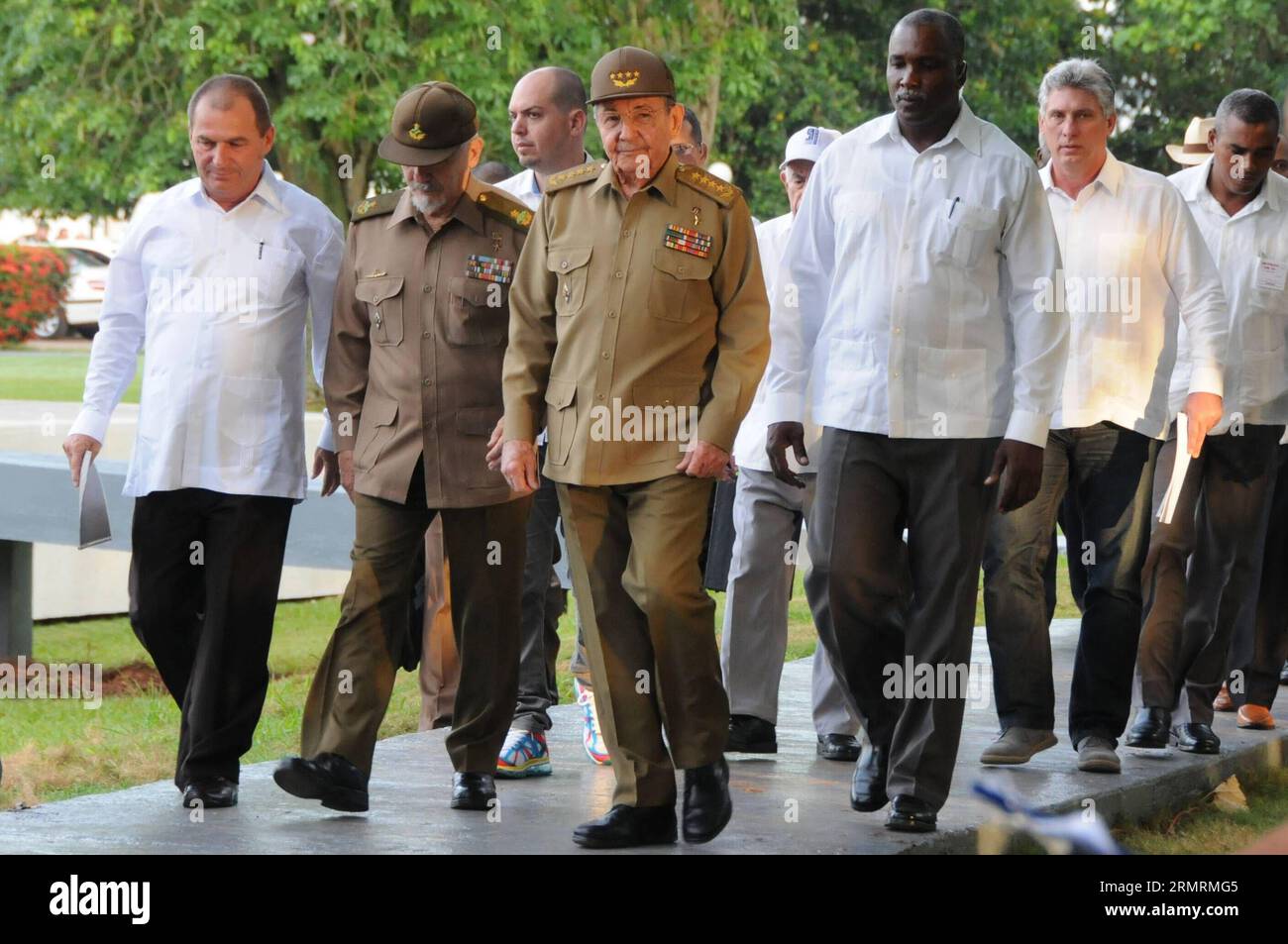 The President of Cuba, Raul Castro(C), accompanied by the first Cuban Vice President, Miguel Diaz Canel (2nd R) arrive for the commemoration ceremony of the National Rebellion Day, in the Mausoleum of the Martyrs, in Artemisa town, Havana Province, Cuba, on July 26, 2014. On July 26, 1953 was the beginning of the Cuban Revolution led by Fidel Castro. (Xinhua/Prensa Latina) CUBA-ARTEMISA-NATIONAL REBELLION DAY-COMMEMORATION PUBLICATIONxNOTxINxCHN   The President of Cuba Raul Castro C accompanied by The First Cuban Vice President Miguel Diaz Canel 2nd r Arrive for The Commemoration Ceremony of T Stock Photo