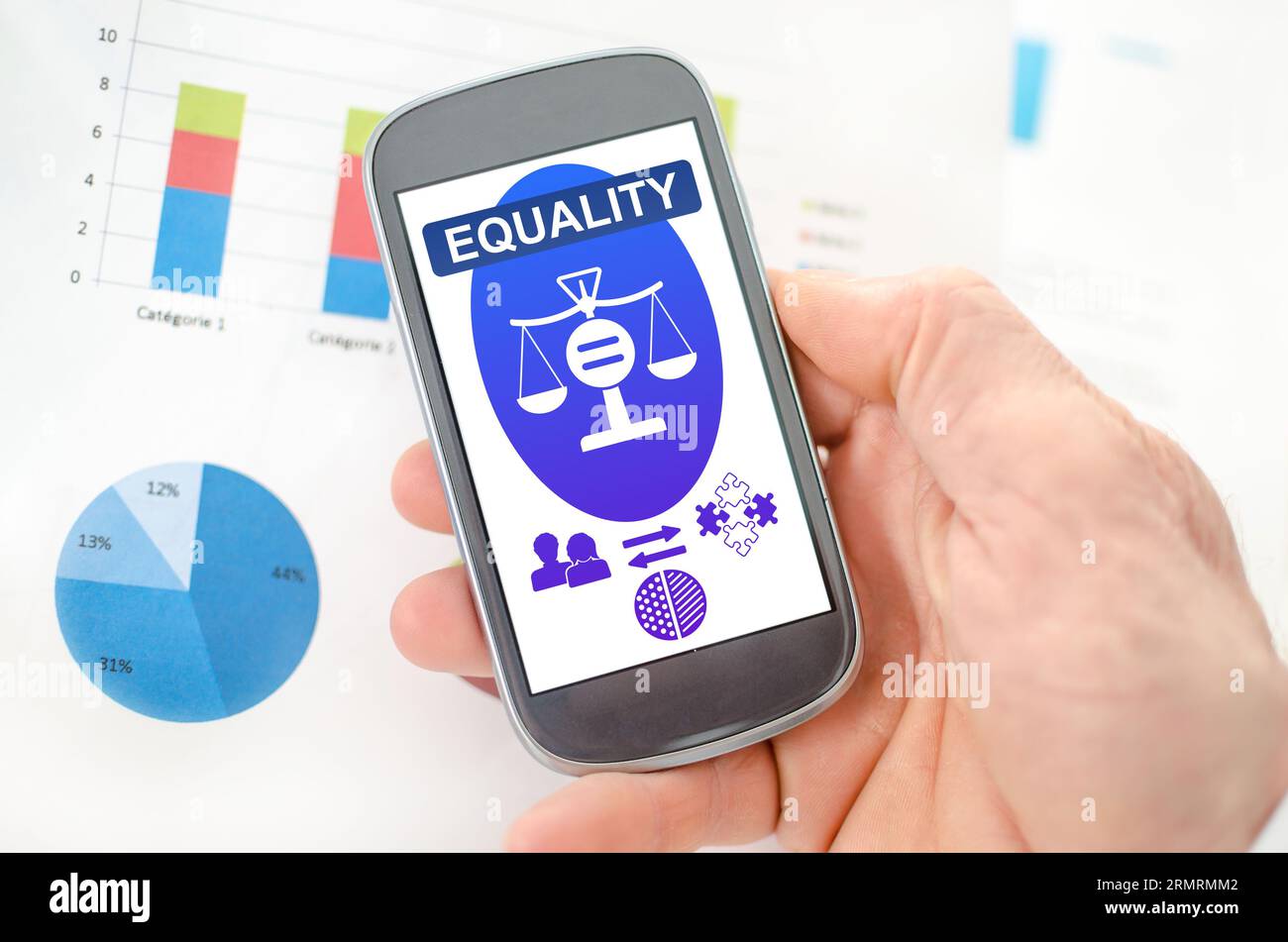 Equality concept on a smartphone held by a hand Stock Photo
