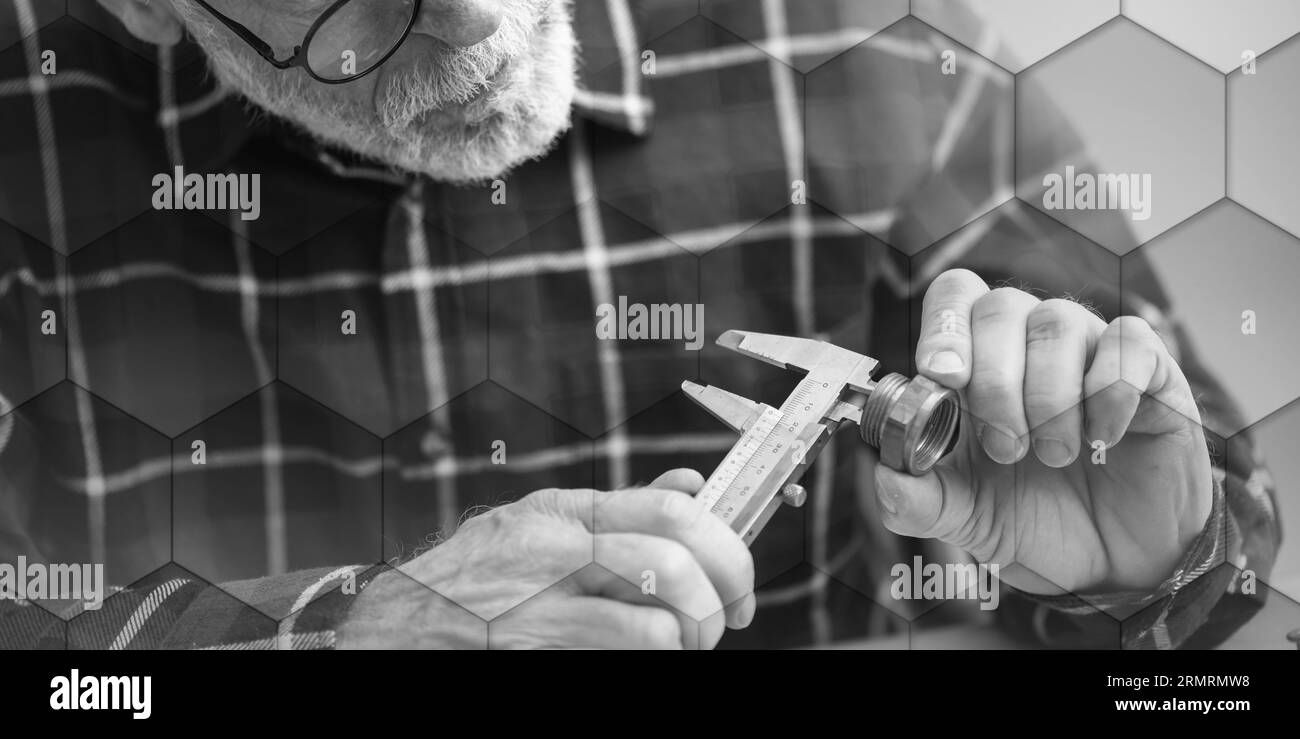 Plumber measuring a plumbing fitting with a caliper, geometric pattern Stock Photo