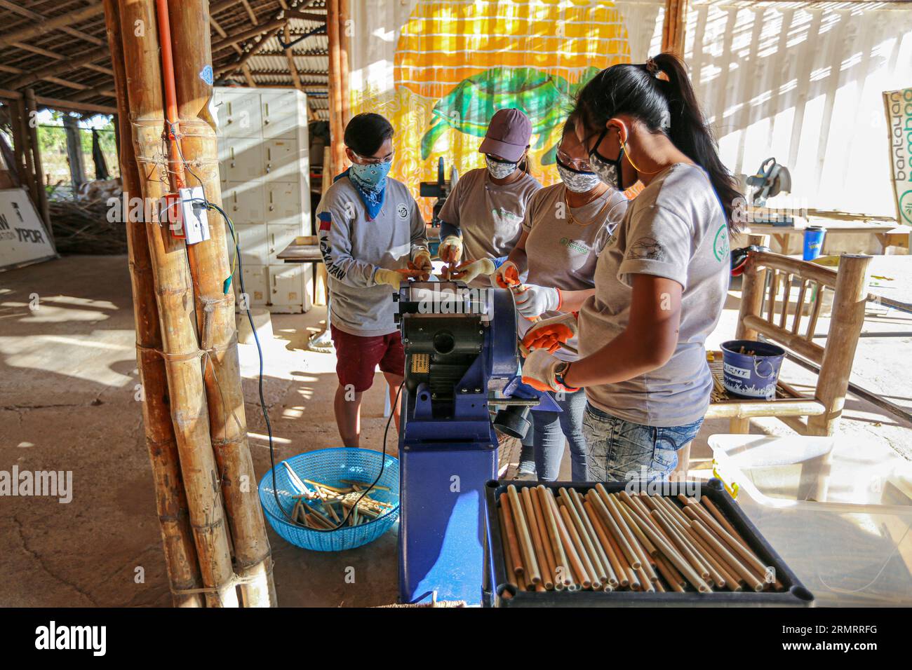 Bamboo straws manufacturing process in social enterprise: Bantayan Bamboo Innovation Workshop. Plastic straw sustainable alternative, eco-friendly Stock Photo
