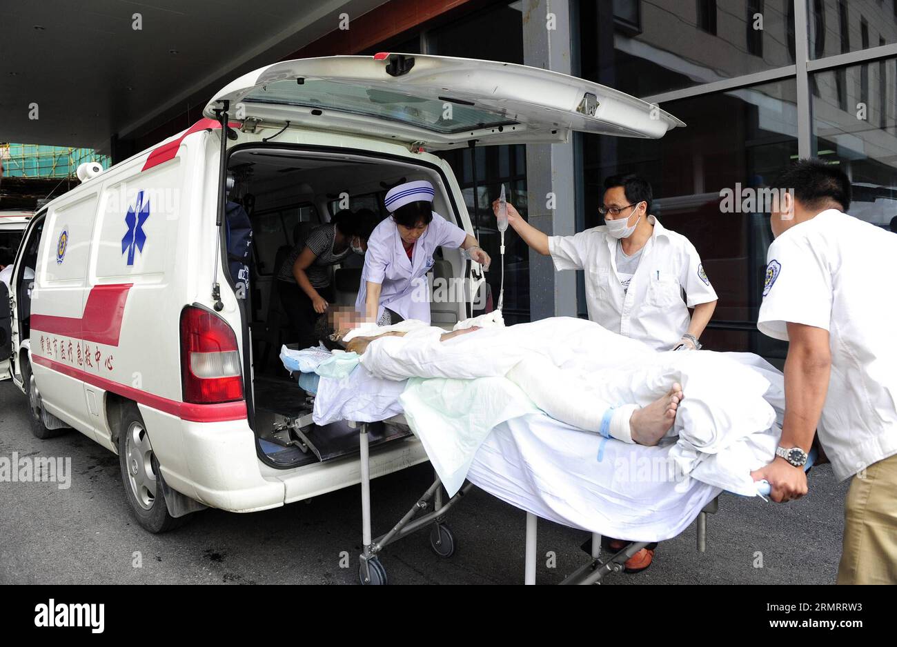 (140802) -- WUXI, Aug. 2, 2014 () -- An injured person of a blast accident in Kunshan arrives at the Third People s Hospital of Wuxi City, east China s Jiangsu province, Aug. 2, 2014. A powerful factory blast has killed 69 people and injured over 180 others in Kunshan on Saturday morning. The injured have been treated in hospitals in Kunshan and the nearby cities of Suzhou, Wuxi and Shanghai. () (wjq) CHINA-JIANGSU-KUNSHAN-FACTORY BLAST-RESCUE (CN) Xinhua PUBLICATIONxNOTxINxCHN   Wuxi Aug 2 2014 to Injured Person of a Blast accident in Kunshan arrives AT The Third Celebrities S Hospital of Wux Stock Photo