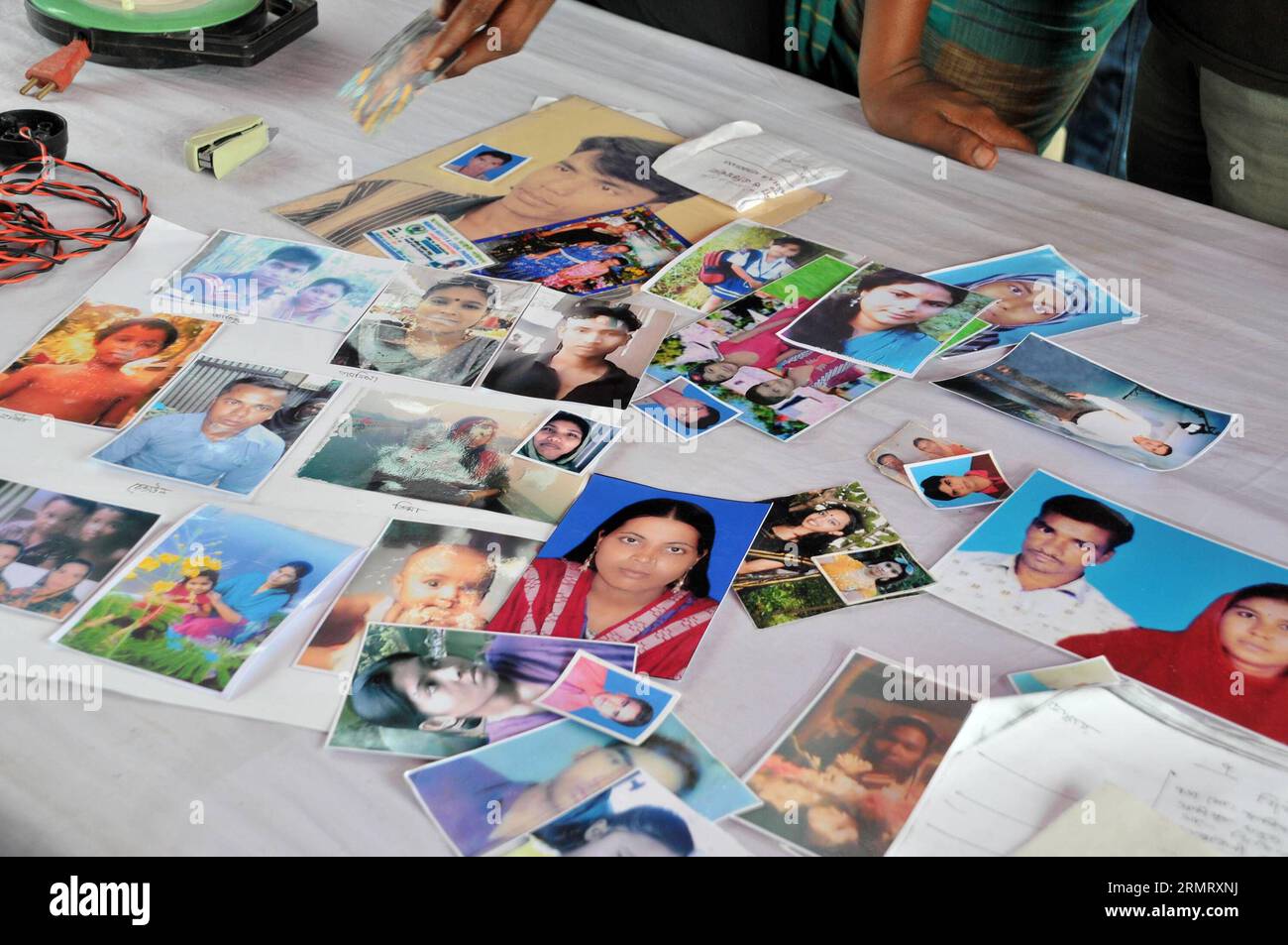 (140806) -- MAWA, Aug. 6, 2014 -- Photo taken on Aug. 6, 2014 shows photos of missing victims two days after the ferry accident at the side of Padma River in Munshiganj district, some 37 km from capital Dhaka, Bangladesh. The death toll of Monday s ferry capsizal in Bangladesh s central Munshiganj district has risen to 11 on Wednesday morning after another seven bodies were retrieved far away from the site where the vessel sank with some 250 passengers on board, police said. ) (lmz) BANGLADESH-DHAKA-FERRY-ACCIDENT SharifulxIslam PUBLICATIONxNOTxINxCHN   Mawa Aug 6 2014 Photo Taken ON Aug 6 201 Stock Photo