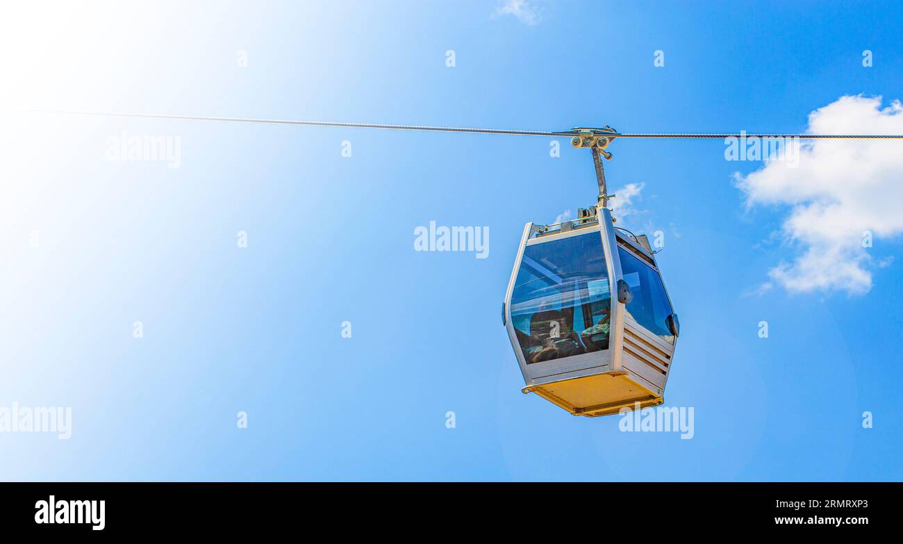 The Cable car cabin against the blue sky close-up Stock Photo - Alamy