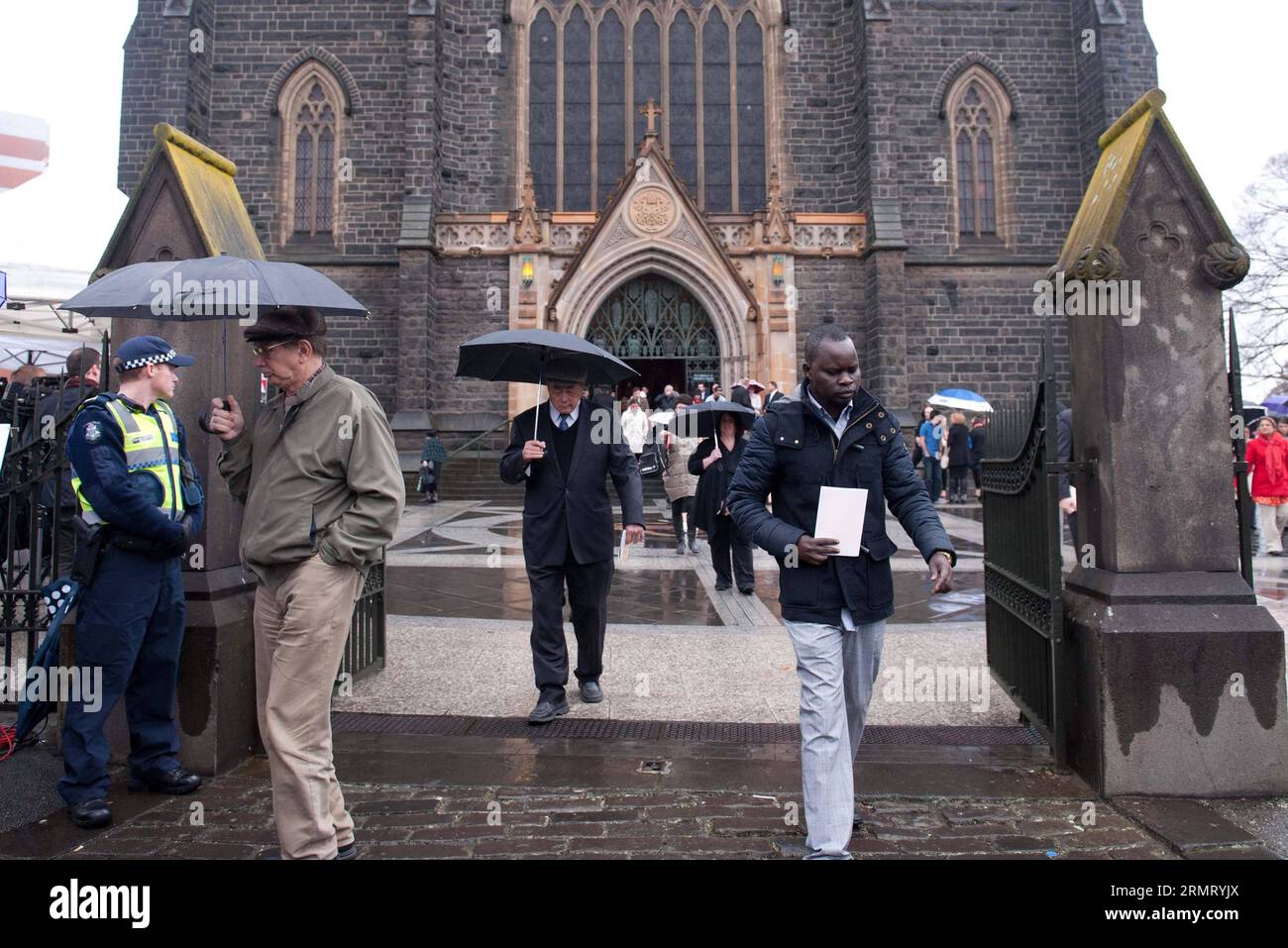 (140807) -- MELBOURNE, Aug. 7, 2014 -- People leave after attending a national memorial service for the MH17 victims at St. Patrick s Cathedral in Melbourne, Australia, Aug. 7, 2014. Australian Prime Minister Tony Abbott was among 1,800 mourners to attend an official memorial service on Thursday in Melbourne for the 298 people killed on the Malaysia Airlines jet shot down in Ukraine. ) AUSTRALIA-MELBOURNE-PM-MEMORIAL SERVICE BaixXue PUBLICATIONxNOTxINxCHN   Melbourne Aug 7 2014 Celebrities Leave After attending a National Memorial Service for The  Victims AT St Patrick S Cathedral in Melbourne Stock Photo