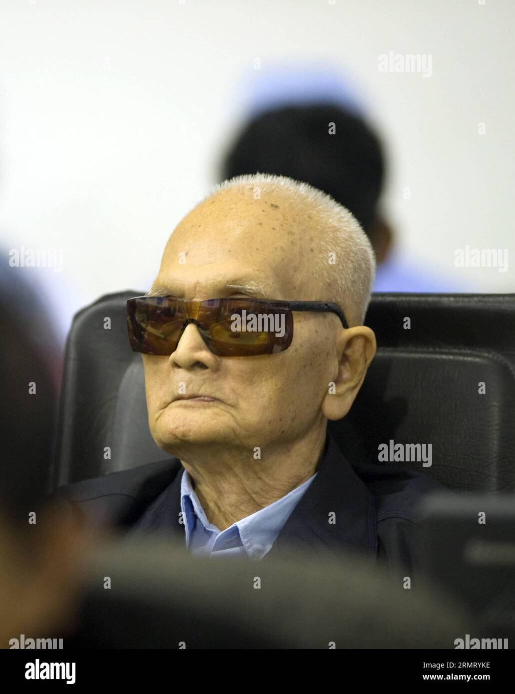 (140807) -- PHNOM PENH, Aug. 7, 2014 -- Nuon Chea, 88, the chief ideologue of the Communist Party of Kampuchea, appears in the courtroom in Phnom Penh, Cambodia, Aug. 7, 2014. The United Nations war crimes tribunal convicted two aging former top leaders of the Democratic Kampuchea, also known as Khmer Rouge, of atrocity crimes against humanity and sentenced them to life in prison, according to a verdict pronounced by the tribunal s president Nil Nonn on Thursday. ) CAMBODIA-PHNOM PENH-VERDICT ECCC PUBLICATIONxNOTxINxCHN Stock Photo