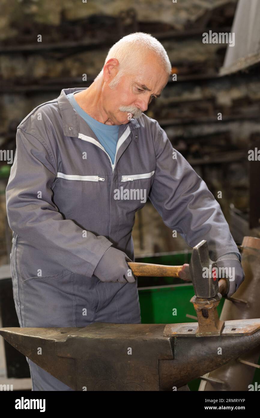 Hands craftsman forging iron hi-res stock photography and images - Alamy