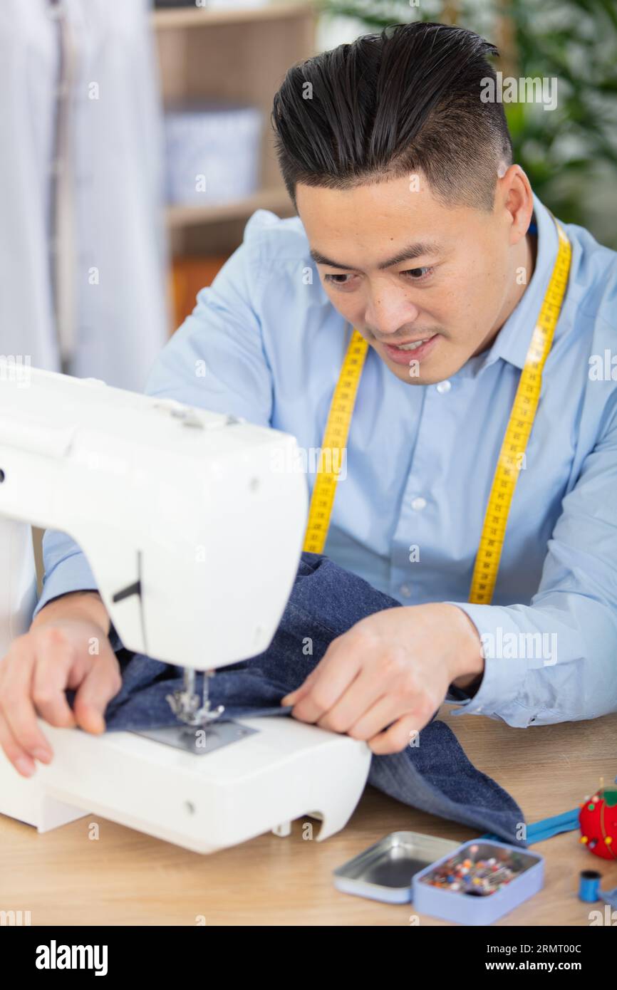 Asian male designer sewing machine hi-res stock photography and images ...