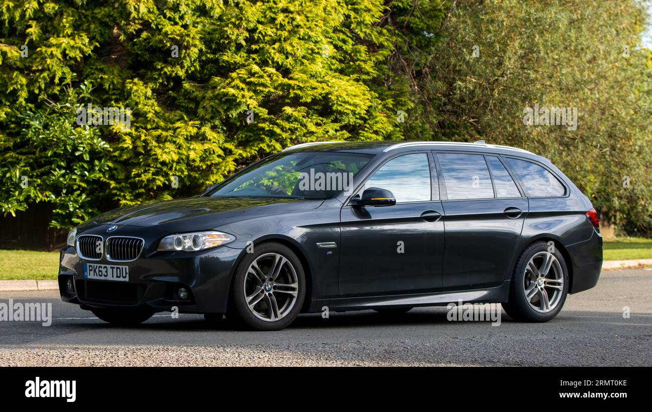 Whittlebury,Northants,UK -Aug 27th 2023: 2013 BMW 520 estate   car travelling on an English country road Stock Photo