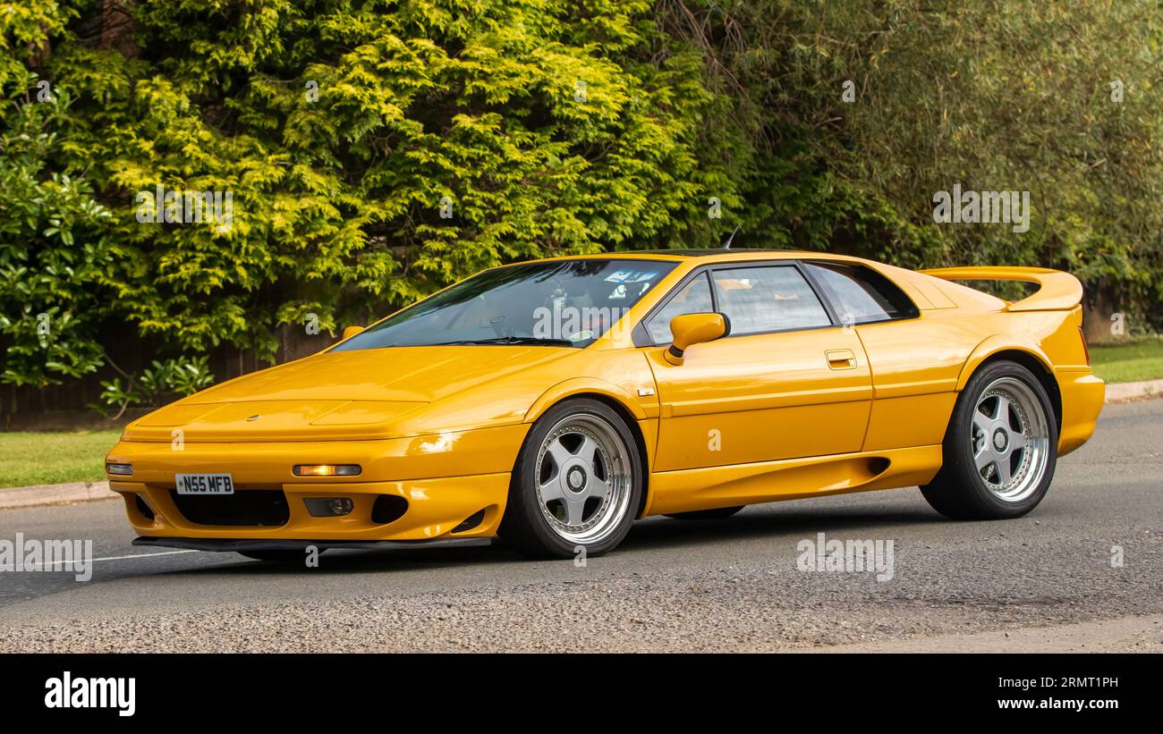 Whittlebury,Northants,UK -Aug 27th 2023:  1996 yellow Lotus Esprit V8 turbo  car travelling on an English country road Stock Photo
