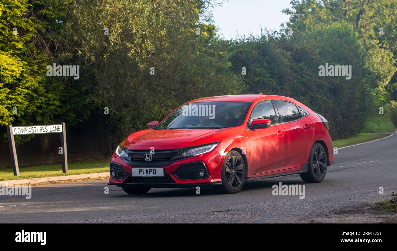 Whittlebury,Northants,UK -Aug 27th 2023:  2017 red Honda Civic sport vtec  car travelling on an English country road Stock Photo