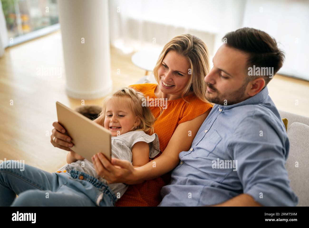 Device technology family online education concept. Happy family with ...