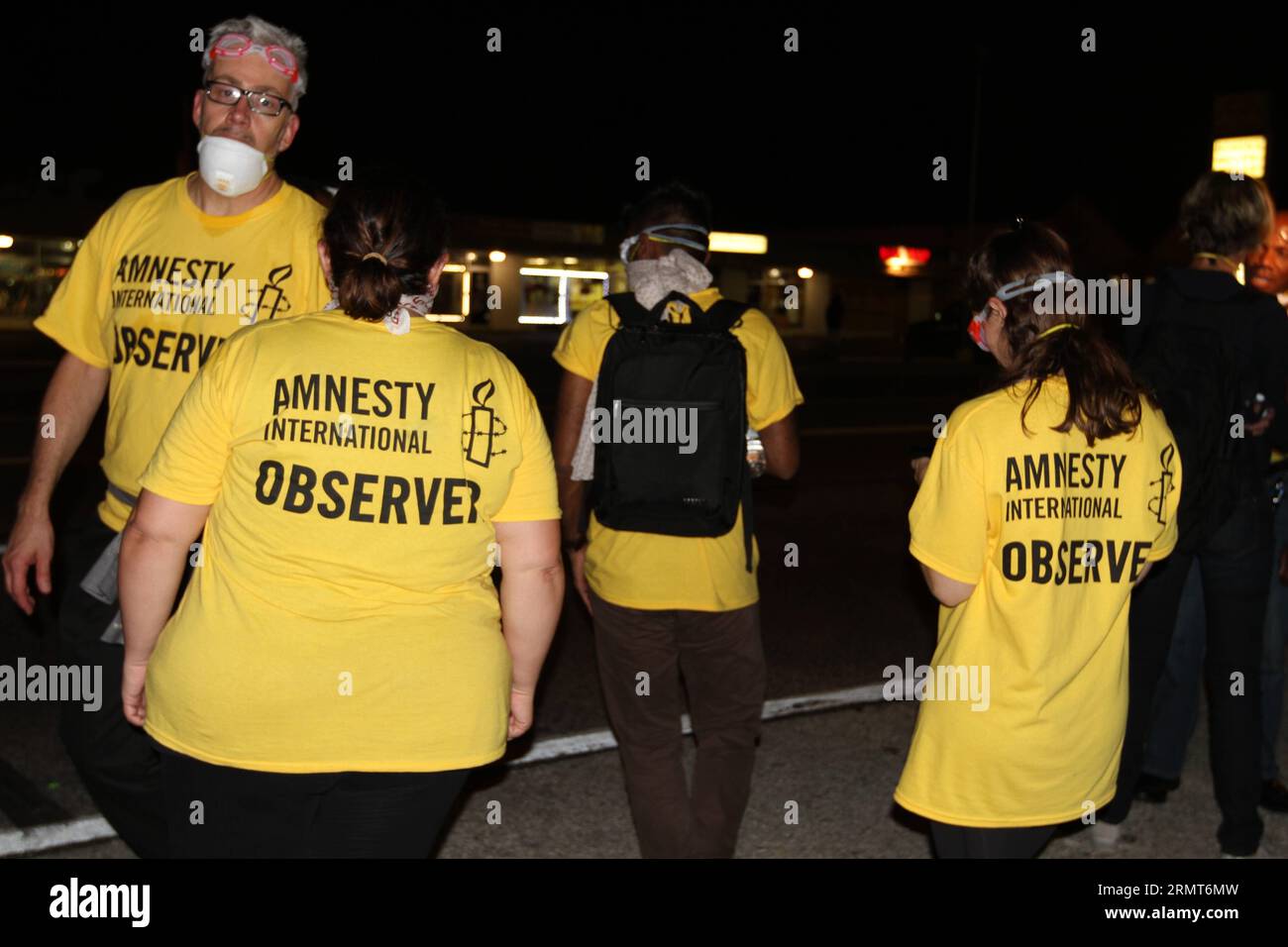 140819 -- FERGUSON, Aug. 19, 2014 -- Amnesty International Observers inspect the scene in Ferguson, Missouri, the United States, on Aug. 19, 2014. On Aug. 9, 18-year-old African American Michael Brown was shot dead by police in Ferguson, sparking a week-long protest in the town where most of the population is black. zhf US-MISSOURI-FERGUSON-PROTEST XuxJing PUBLICATIONxNOTxINxCHN Stock Photo
