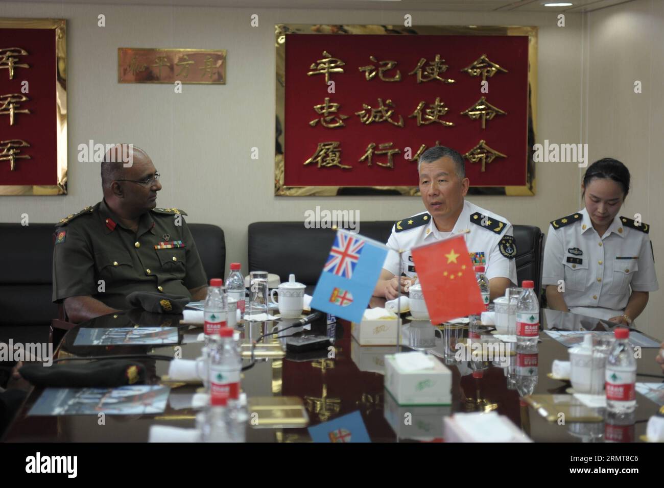 (140822) -- SUVA, Aug. 22, 2014 -- Shen Hao (C), deputy commander of the East China Sea Fleet of the Chinese Navy and commander of Mission Harmony-2014 , meets with Brig. Gen. Mohammed Aziz (L), chief-of-staff of the Republic of Fiji Military Forces in Suva, Fiji, Aug. 22, 2014. Peace Ark, hospital ship of China s People s Liberation Army Navy, arrived at the Fijian capital of Suva on Friday, kicking off its week-long medical assistance mission in the South Pacific island country. ) FIJI-SUVA-CHINA S PEACE ARK HOSPITAL SHIP MichaelxYang PUBLICATIONxNOTxINxCHN   Suva Aug 22 2014 Shen Hao C Depu Stock Photo