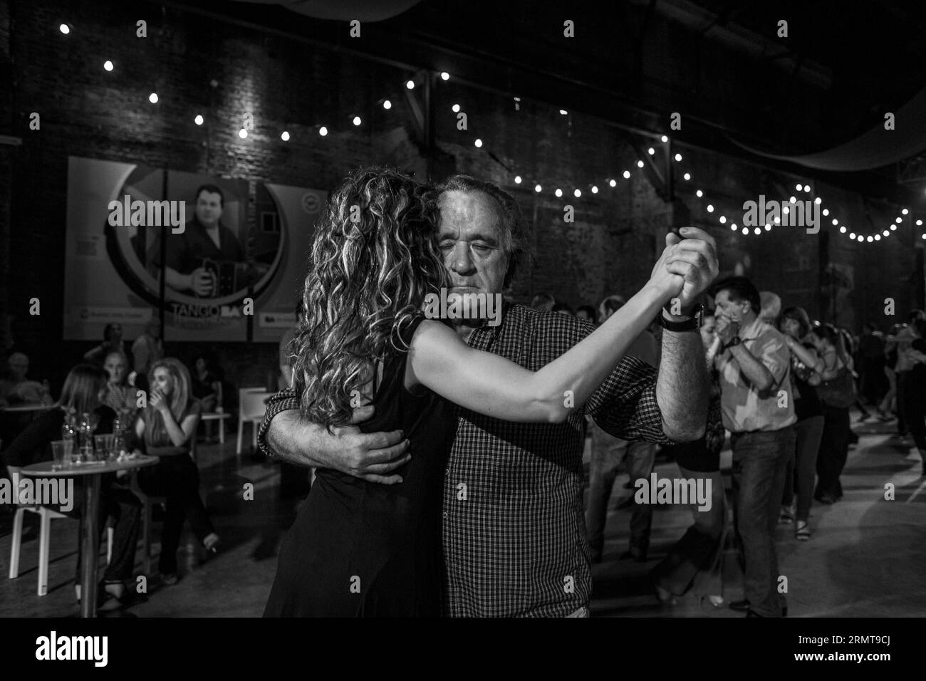 People dance tango during a Milonga event under the circumstance of the Tango World Cup, in Buenos Aires City, Argentina, Aug. 23, 2014. The festival and the world cup is held from Aug. 13 to 26, offering Milongas or dance events with live music, conferences, theme exhibitions, performances, dance seminars, etc., in addition to the official competences with 574 participants from 37 countries around the world. Martin Zabala) (zjy) ARGENTINA-BUENOS AIRES-TANGO e MARTINxZABALA PUBLICATIONxNOTxINxCHN   Celebrities Dance Tango during a  Event Under The Circumstance of The Tango World Cup in Buenos Stock Photo