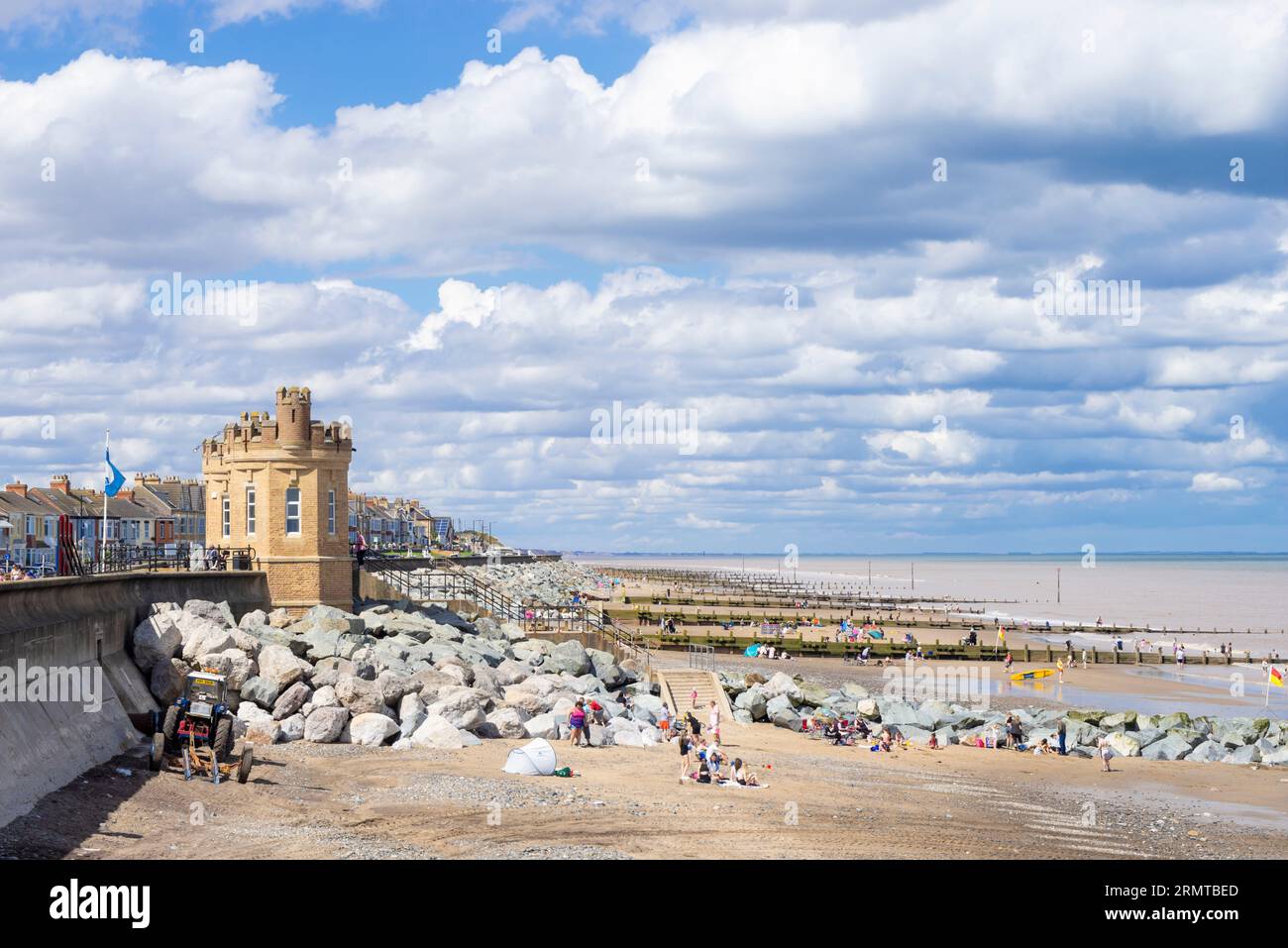 Withernsea Beach a large sandy beach with holidaymakers enjoying summer Withernsea East Riding of Yorkshire England UK GB Europe Stock Photo