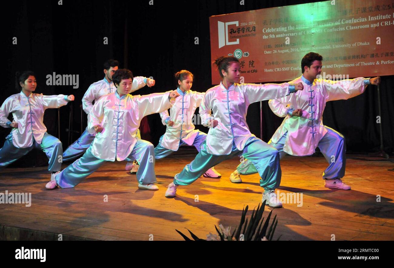 A Chinese teacher and her Bangladeshi students perform Taiji, a