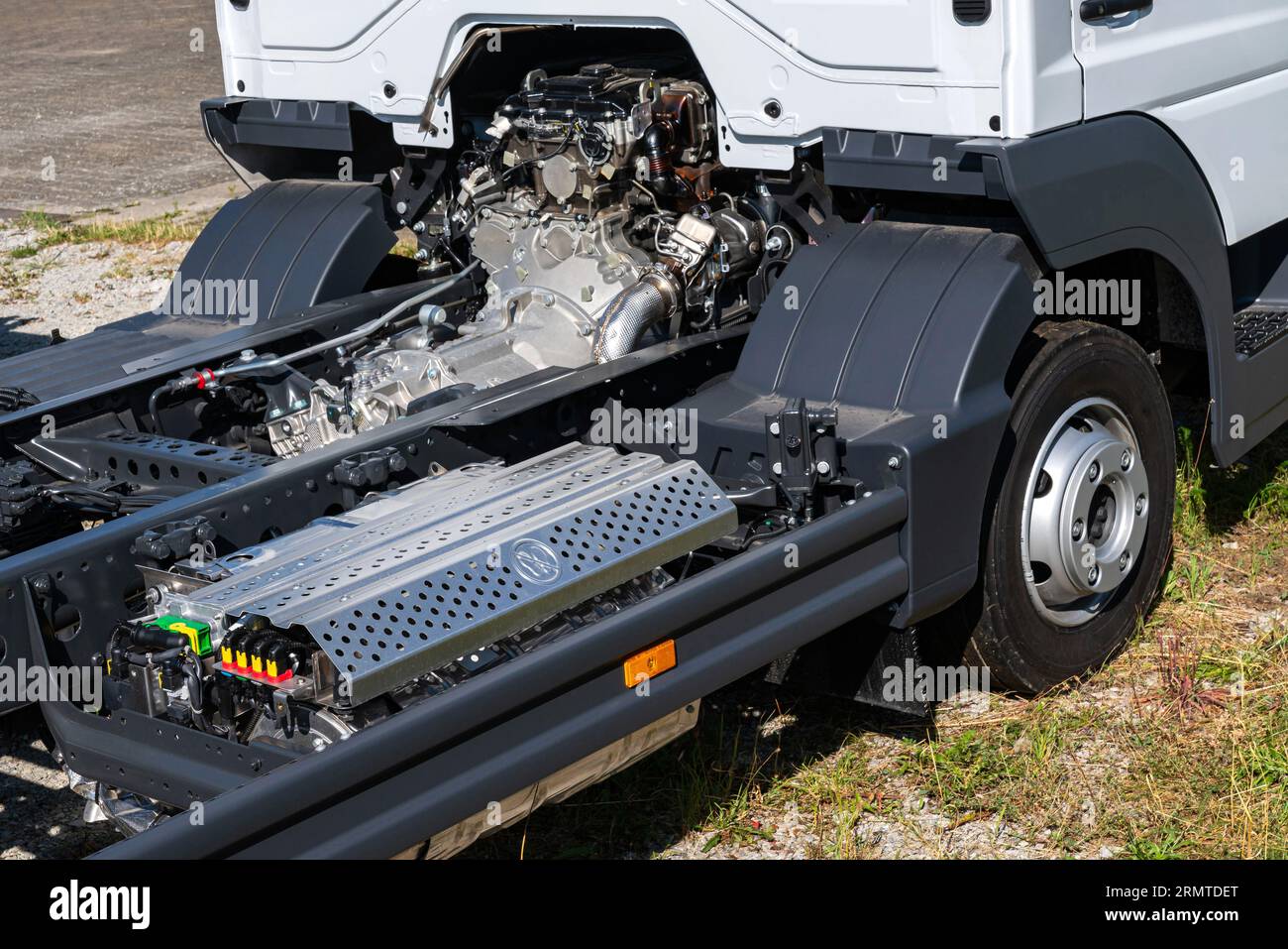 Part of a semi-truck with a view of the engine and part of the cabin.. Stock Photo