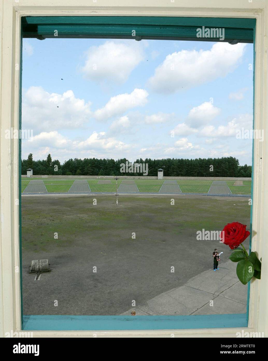 (140901) -- FRANKFURT (GERMANY), Sept. 1, 2014 -- The former Sachsenhausen Nazi concentration camp is seen through a window of tower A in Oranienburg, near Berlin, Germany, on Aug. 21, 2014. The Sachsenhausen Nazi concentration camp was built in Oranienburg about 35 km north of Berlin in 1936 and imprisoned about 220,000 people between 1936 and 1945. The site now served as a memorial and museum to learn about the history within the authentic surroundings, including the remnants of buildings and other relics of the camp. ) GERMANY-SACHSENHAUSEN CONCENTRATION CAMP luoxhuanhuan PUBLICATIONxNOTxIN Stock Photo