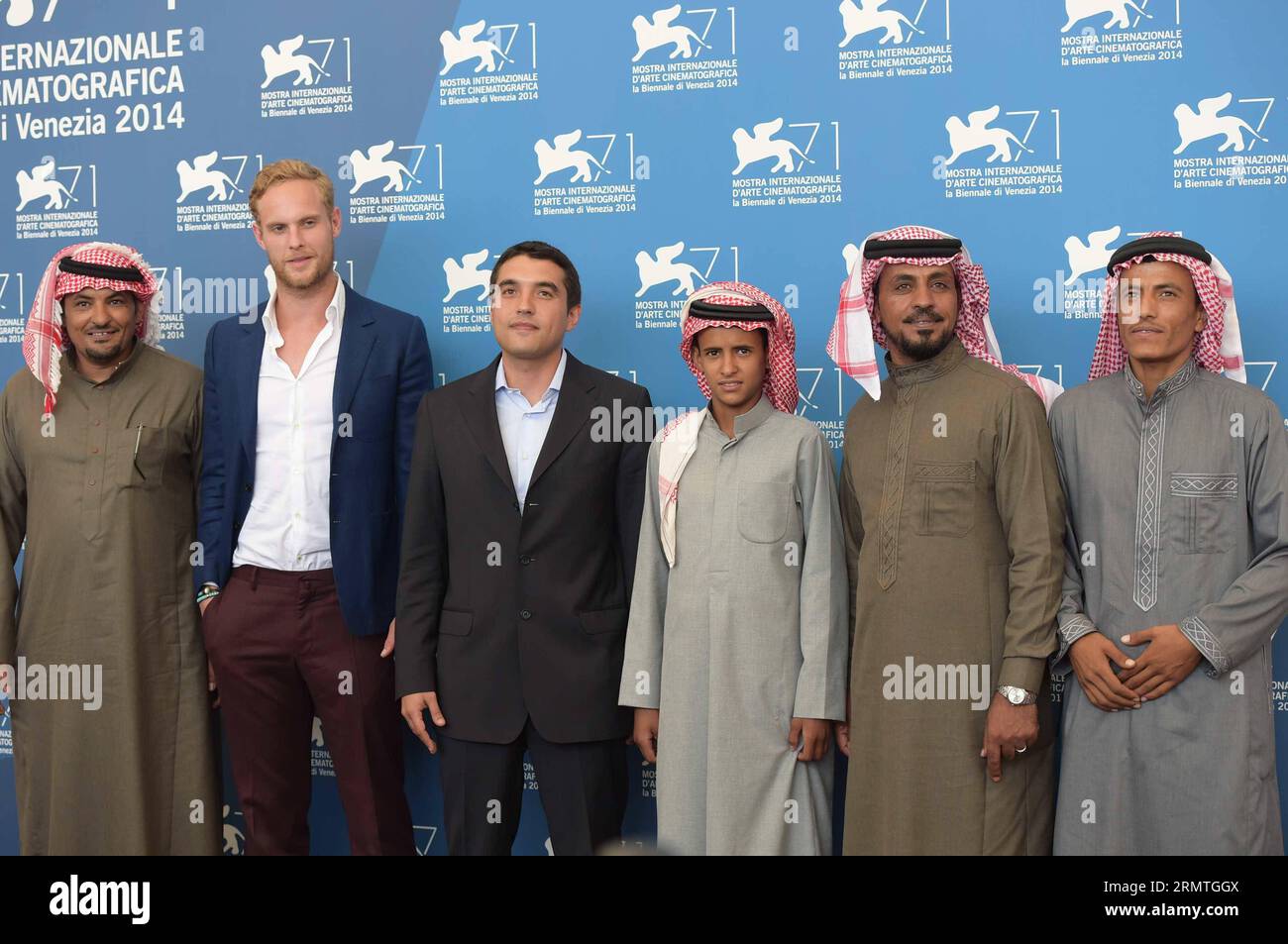 (140904) -- VENICE, Sept. 4, 2014 -- Actor Jack Fox (2nd L), director Naji Abu Nowar (3rd L), actor Jacir Eid (4th L) and other cast members pose during the photo call for Theeb which is selected for the horizons competition during the 71st Venice Film Festival, in Lido of Venice, Italy, Sept. 4, 2014. ) (zjy) ITALY-VENICE-FILM FESTIVAL-PHOTO CALL-THEEB LiuxLihang PUBLICATIONxNOTxINxCHN   Venice Sept 4 2014 Actor Jack Fox 2nd l Director Naji Abu Nowar 3rd l Actor Jacir Oath 4th l and Other Cast Members Pose during The Photo Call for  Which IS Selected for The HORIZONS Competition during The 71 Stock Photo
