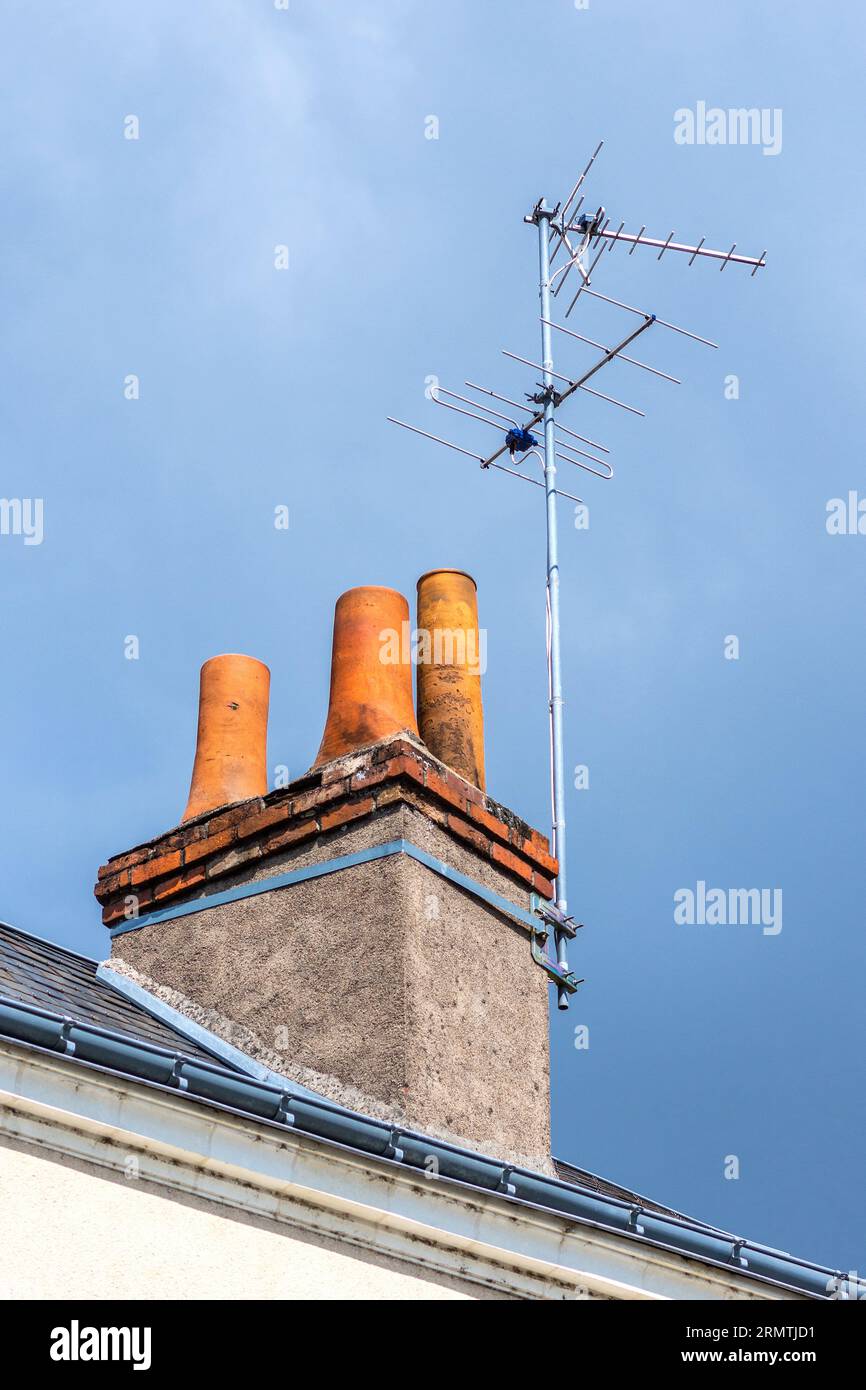 TV aerials attached to chimney stack - Tours, Indre-et-Loire (37), France. Stock Photo