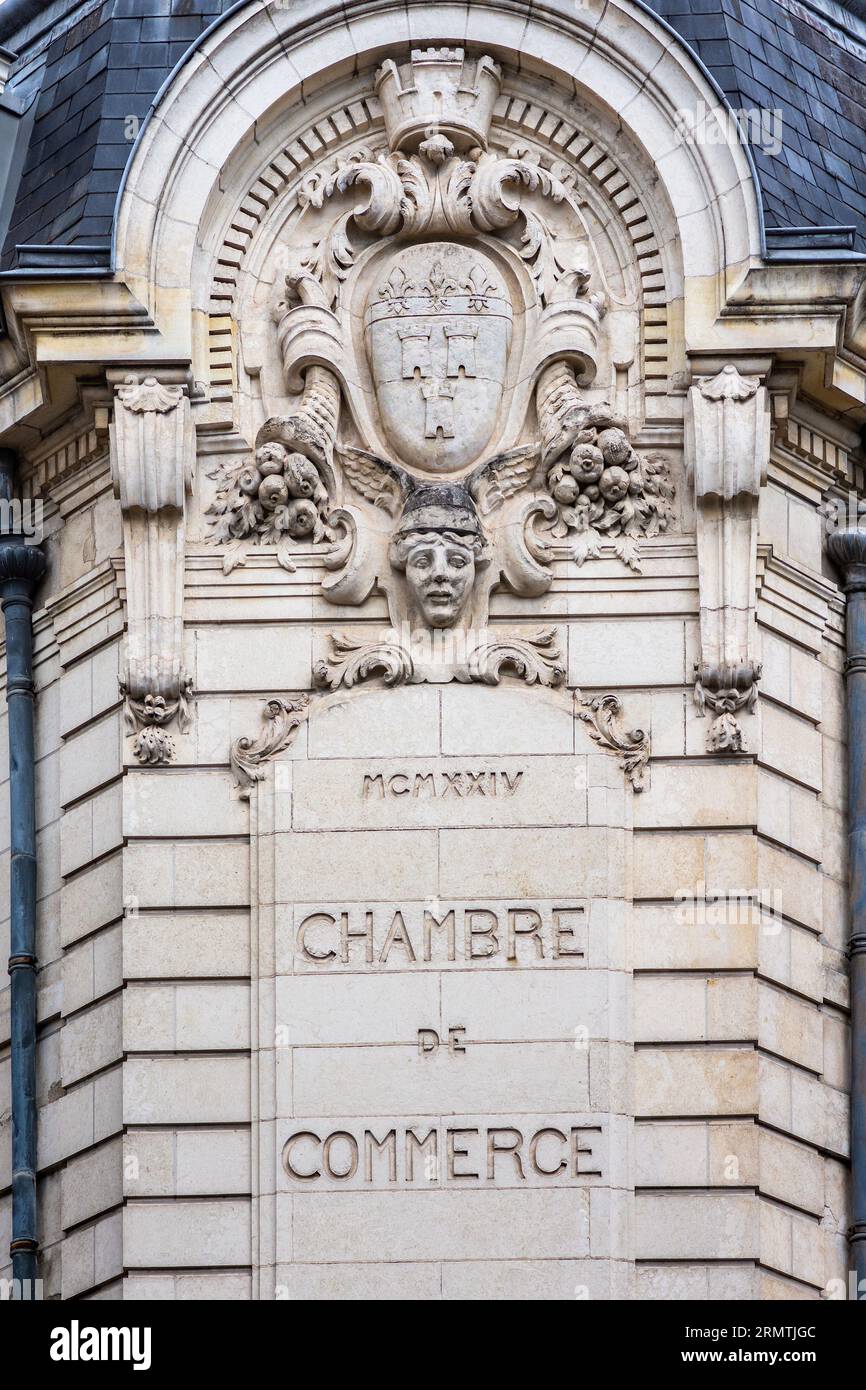 1924 architectural detail in stonework above Chamber of Commerce building  - Tours, Indre-et-Loire (37), France. Stock Photo