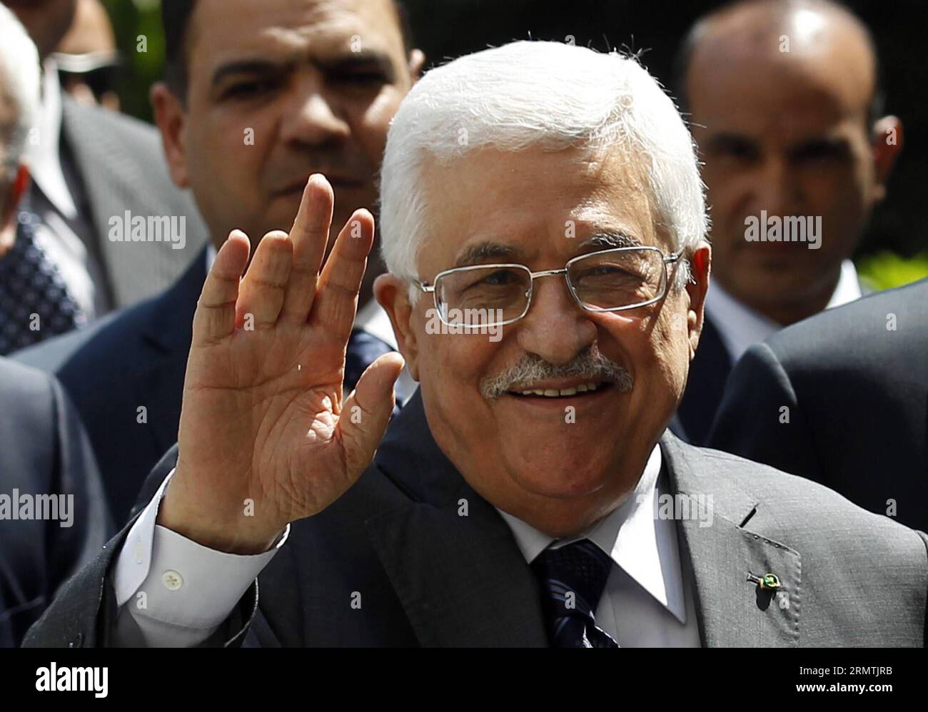 (140907) -- CAIRO, Sept. 7, 2014 -- Palestinian President Mahmoud Abbas waves as he attends an Arab League emergency meeting in Cairo, Egypt, Sept. 7, 2014. Arab foreign ministers were expected to issue a resolution to confront militants overrunning large areas of Iraq and Syria and declared a cross-border Islamic States. ) EGYPT-ARAB LEAGUE-EMERGENCY MEETING AhmedxGomaa PUBLICATIONxNOTxINxCHN   Cairo Sept 7 2014 PALESTINIAN President Mahmoud Abbas Waves As he Attends to Arab League EMERGENCY Meeting in Cairo Egypt Sept 7 2014 Arab Foreign Minister Were expected to Issue a Resolution to confro Stock Photo