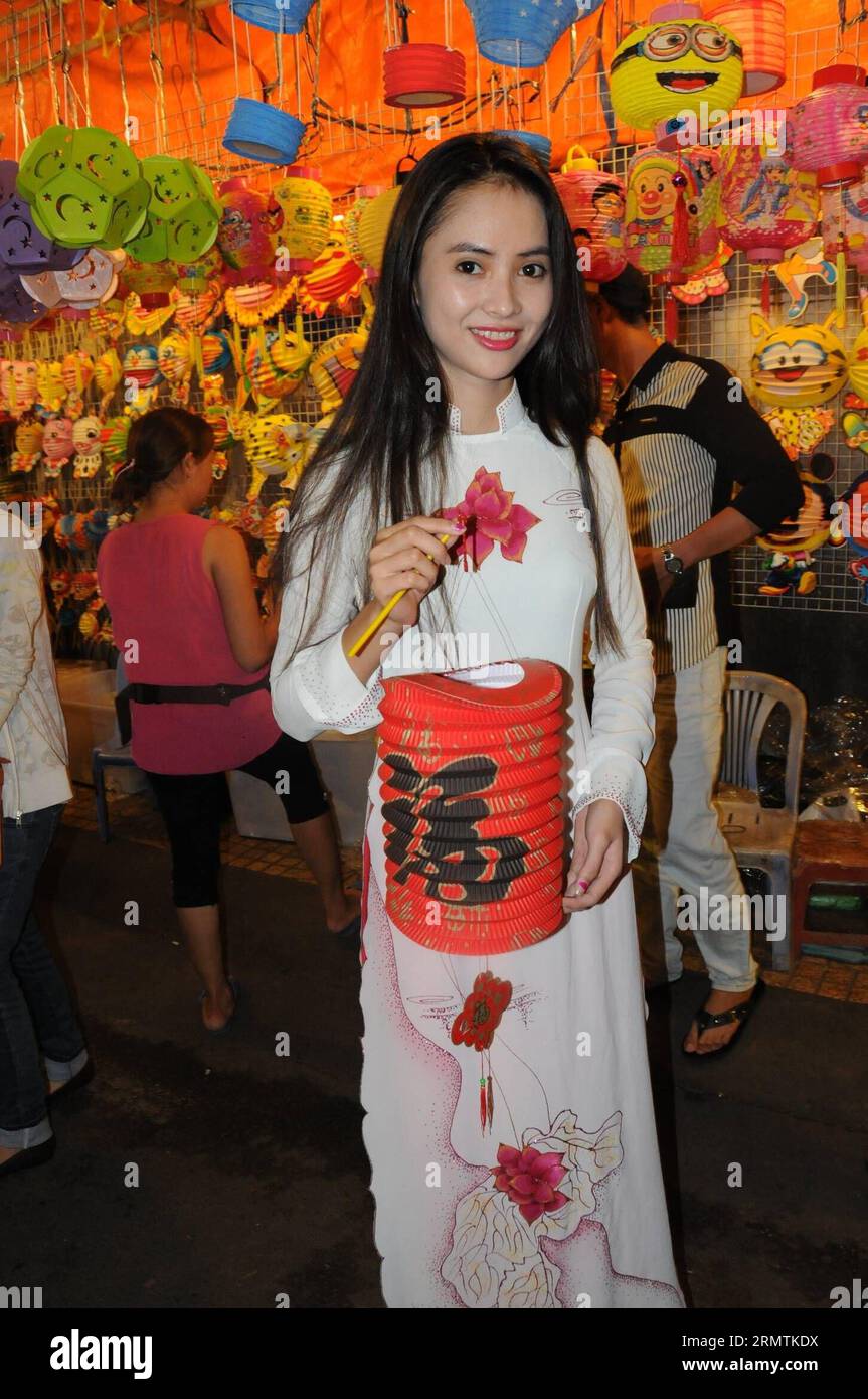 A girl poses for pictures during a visit to the Lantern Street in Ho Chi Minh City, on Sept. 8, 2014. The Mid-Autumn festival is one of the biggest celebrations of the year in Vietnam. ) VIETNAM-HO CHI MINH CITY-MID-AUTUMN FESTIVAL-LANTERN TaoxJun PUBLICATIONxNOTxINxCHN   a Girl Poses for Pictures during a Visit to The Lantern Street in Ho Chi Minh City ON Sept 8 2014 The Mid Autumn Festival IS One of The Biggest celebrations of The Year in Vietnam Vietnam Ho Chi Minh City Mid Autumn Festival Lantern  PUBLICATIONxNOTxINxCHN Stock Photo