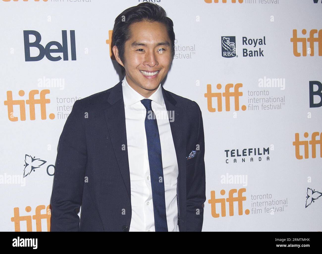 (140911) -- TORONTO,  -- Actor Justin Chon poses for photos before the world premiere of the film Revenge of The Green Dragons at Ryerson Theater during the 39th Toronto International Film Festival in Toronto, Canada, Sept. 10, 2014. ) CANADA-TORONTO-INTERNATIONAL FILM FESTIVAL-FILM REVENGE OF THE GREEN DRAGONS ZouxZheng PUBLICATIONxNOTxINxCHN   Toronto Actor Justin Chon Poses for Photos Before The World Premiere of The Film Revenge of The Green Dragons AT Ryerson Theatre during The 39th Toronto International Film Festival in Toronto Canada Sept 10 2014 Canada Toronto International Film Festiv Stock Photo