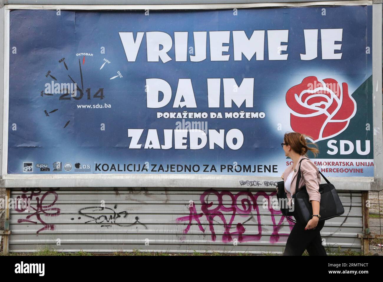 A resident passes by a campaign poster in the center of Sarajevo, Bosnia and Herzegovina, on Sept. 12, 2014. With the month-long campaign for the general elections officially kicking off in BiH on Friday, the Balkan state begins the complex process to bring in new governments, assemblies and presidencies in different levels. ) BOSNIA AND HERZEGOVINA-SARAJEVO-GENERAL ELECTIONS-CAMPAIGN HarisxMemija PUBLICATIONxNOTxINxCHN   a Resident Pass by a Campaign Poster in The Center of Sarajevo Bosnia and Herzegovina ON Sept 12 2014 With The Month Long Campaign for The General Elections officially KICKIN Stock Photo